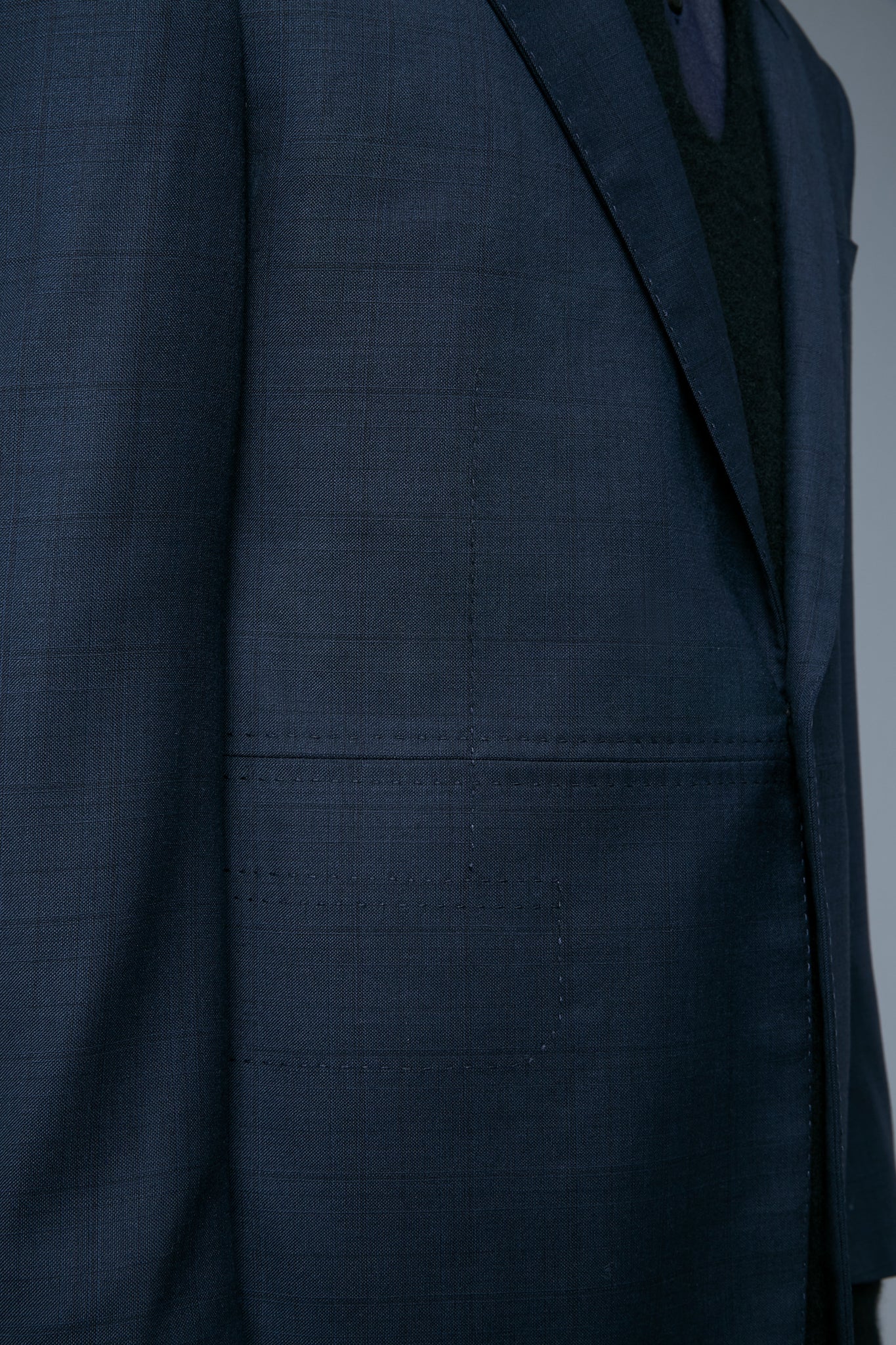 Detail View: Model Qiang Li wearing Notch Lapel Jacket