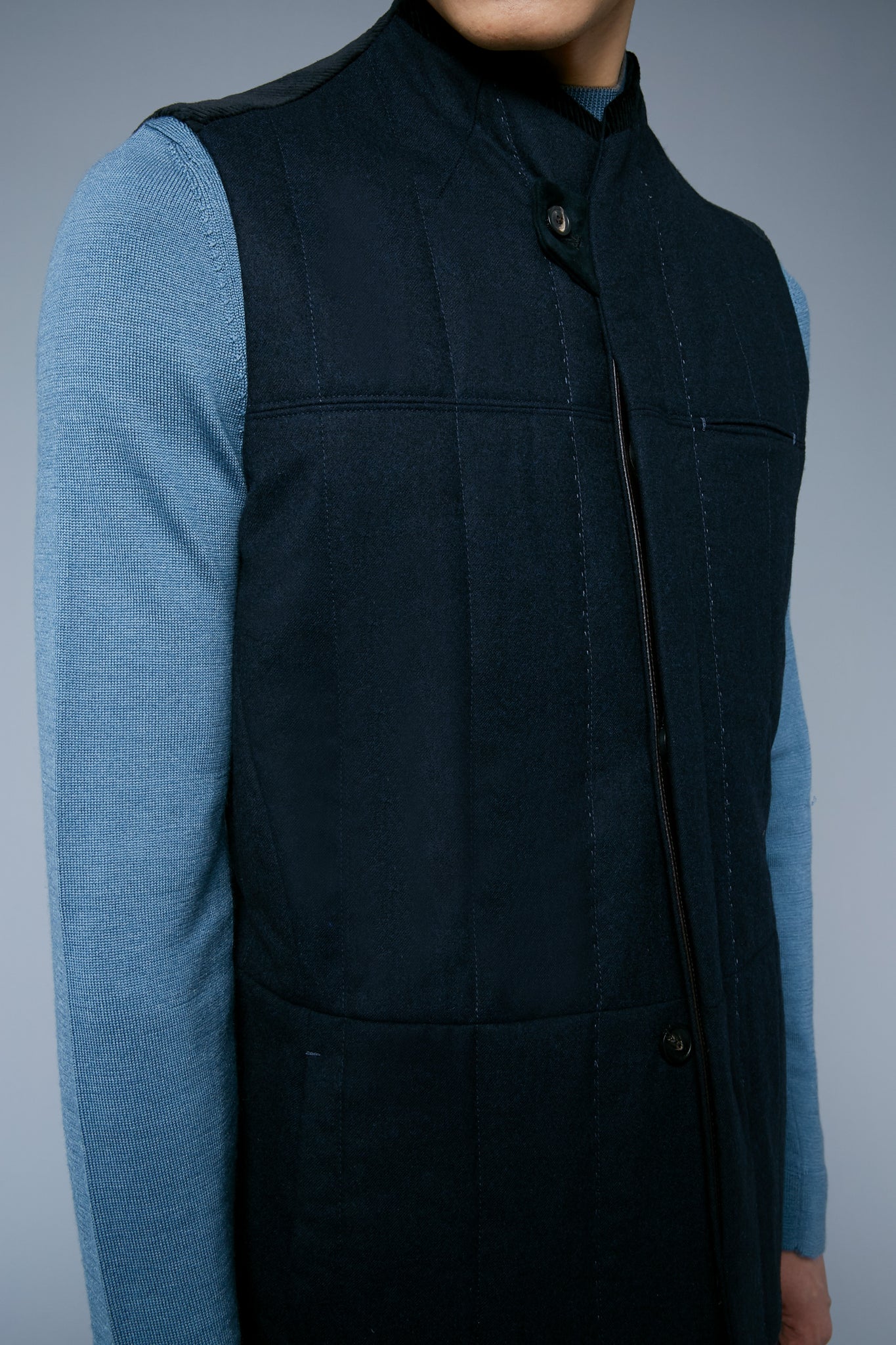 Detail View: Model Qiang Li wearing Down Vest
