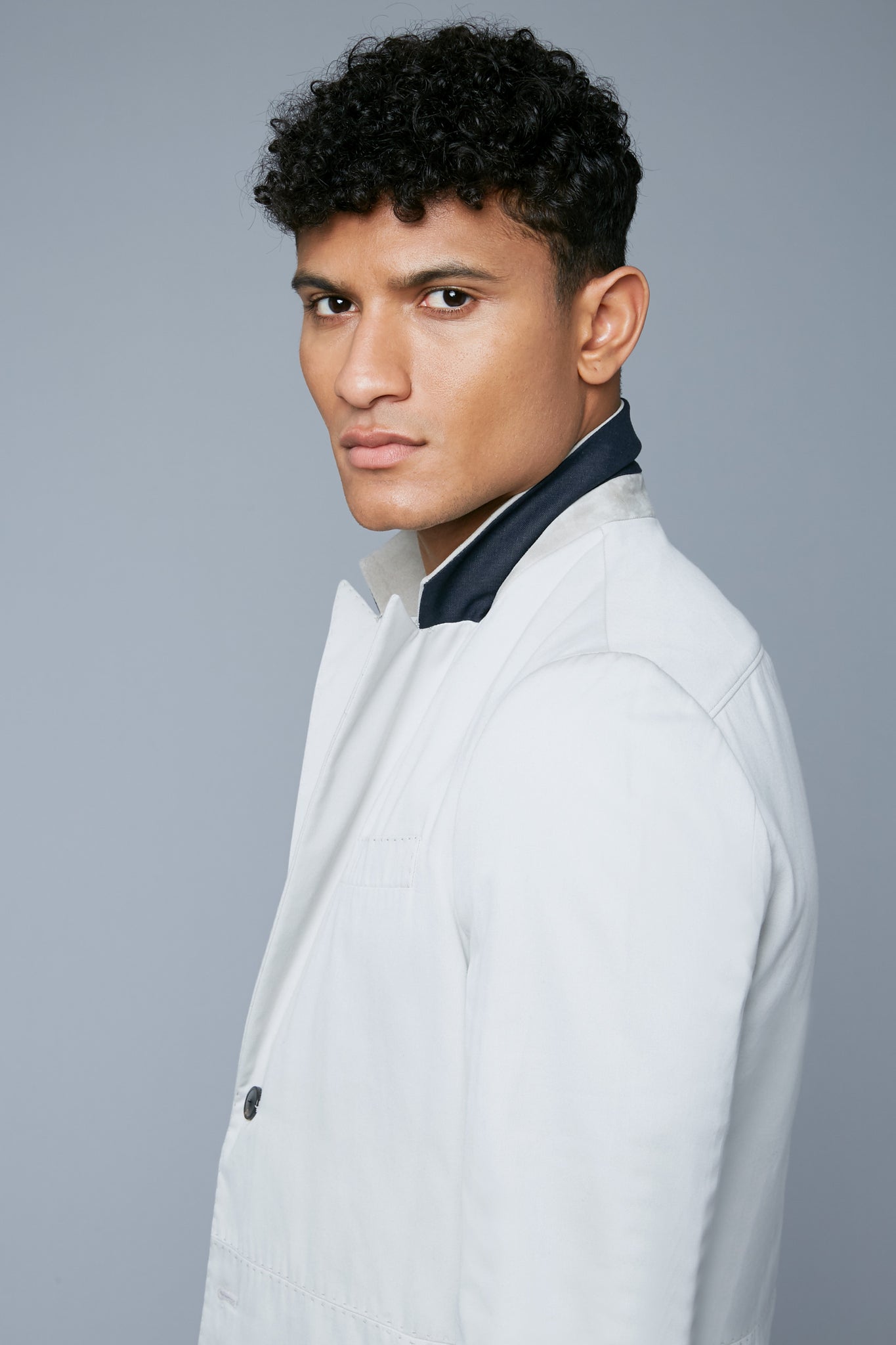 Detail View: Model Tre Boutilier wearing Peak Summer Jacket