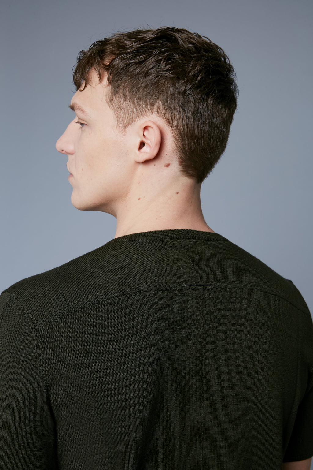 Detail View: Model Milos Drago wearing Short Sleeve Sweater Tee