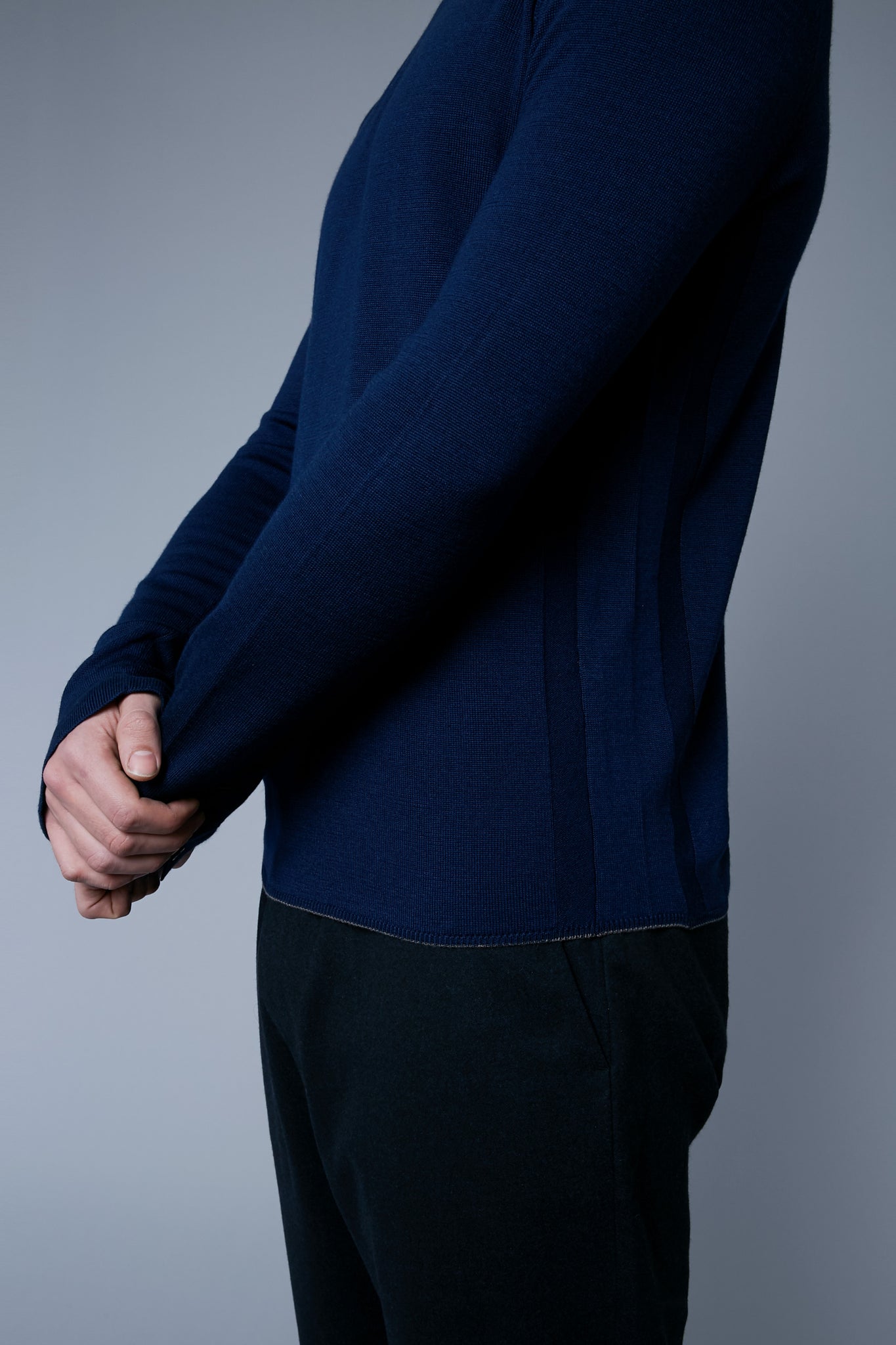 Detail View: Model Milos Drago wearing Long Sleeve Sweater Tee