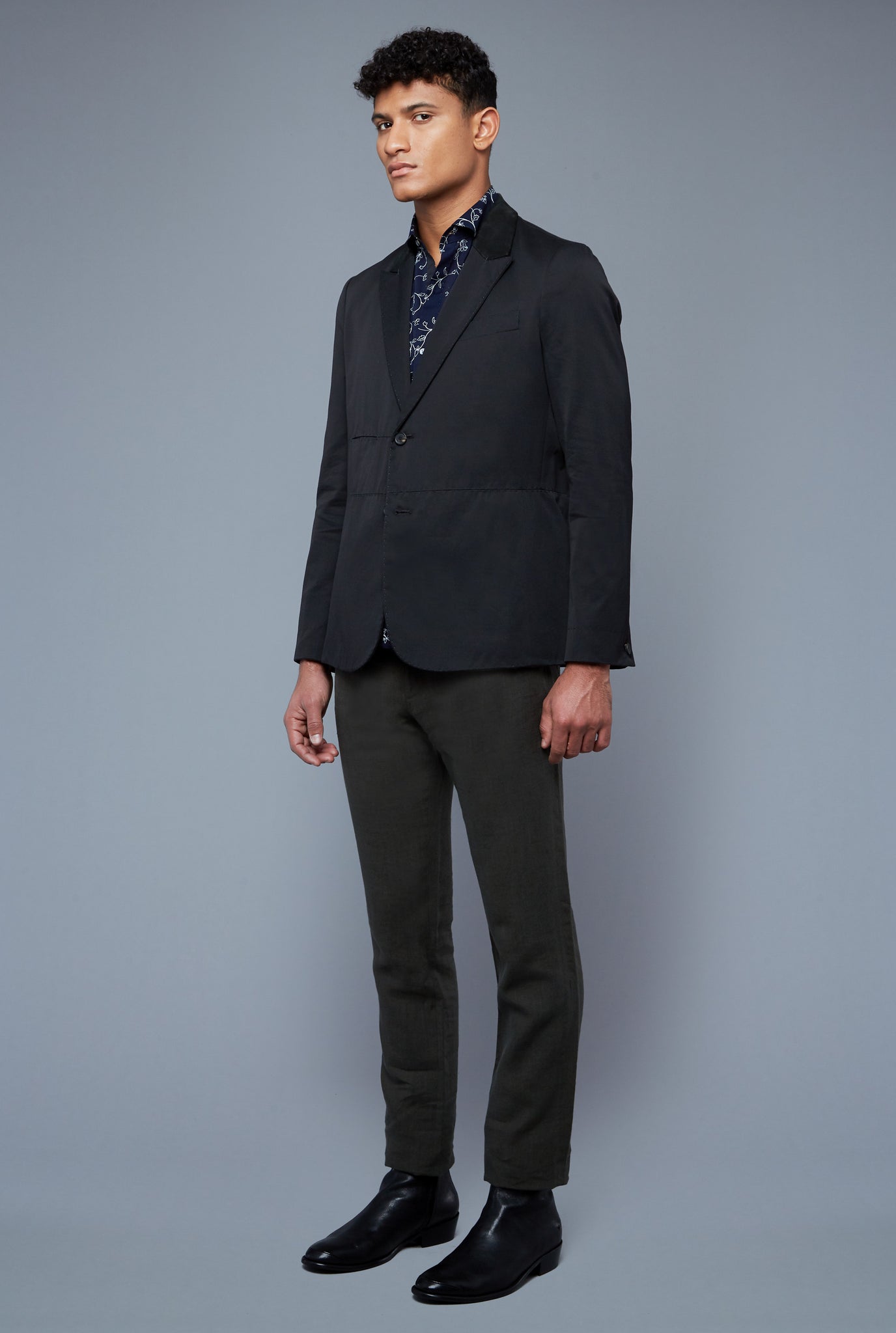 Three Quarter View: Model Tre Boutilier wearing Peak Summer Jacket