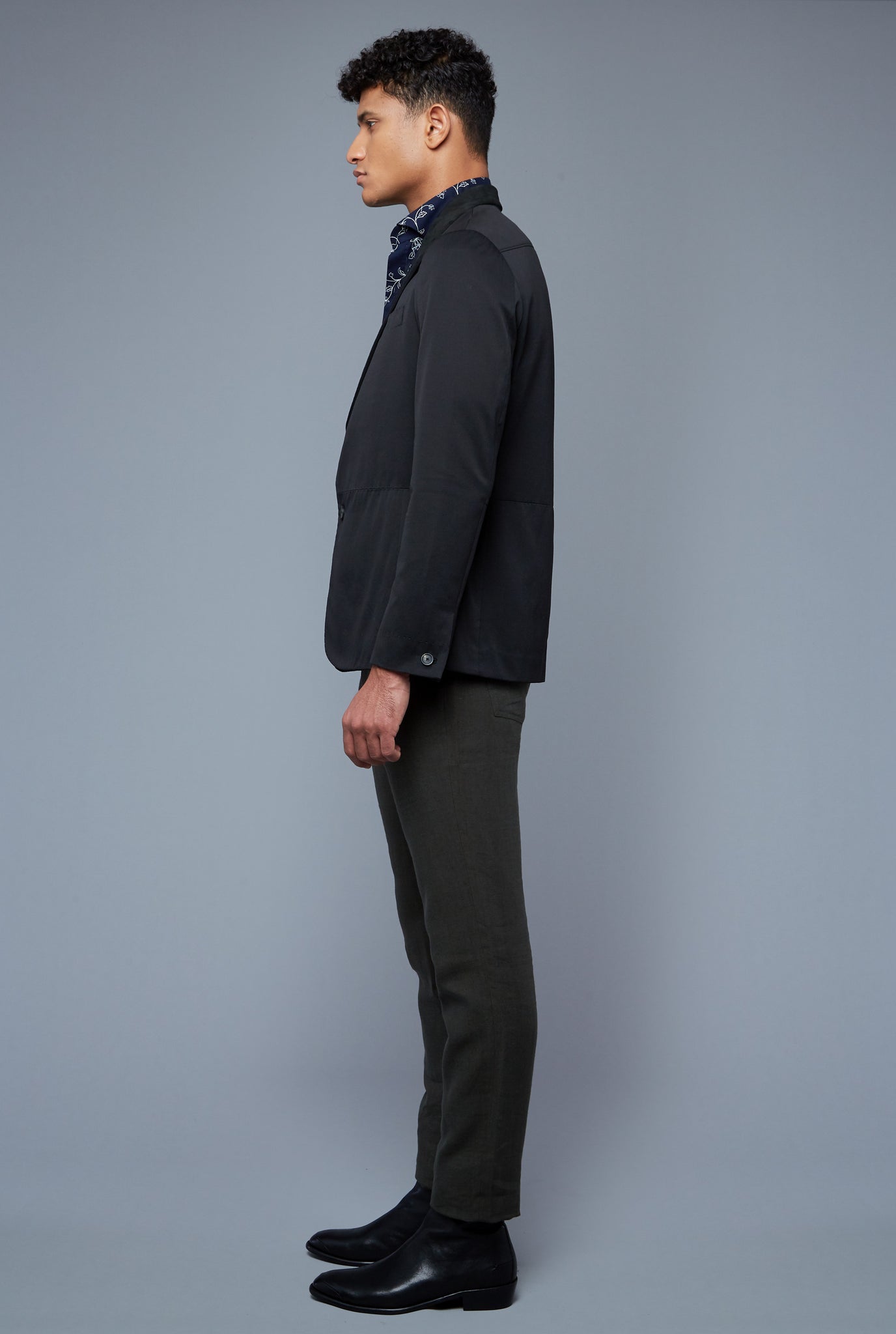 Side View: Model Tre Boutilier wearing Peak Summer Jacket