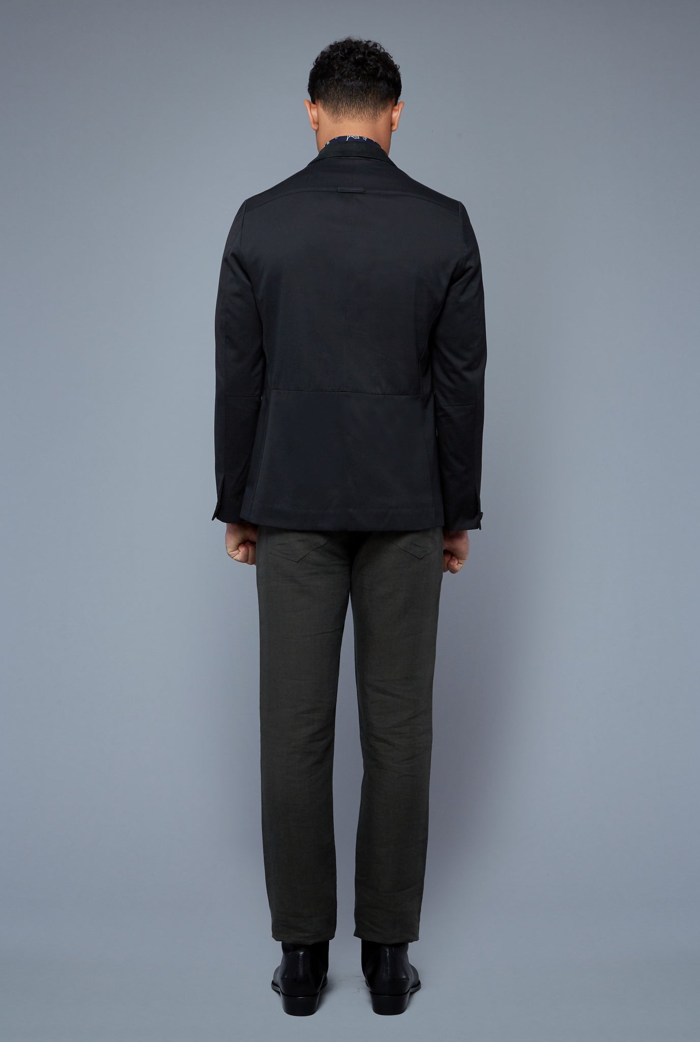 Back View: Model Tre Boutilier wearing Peak Summer Jacket