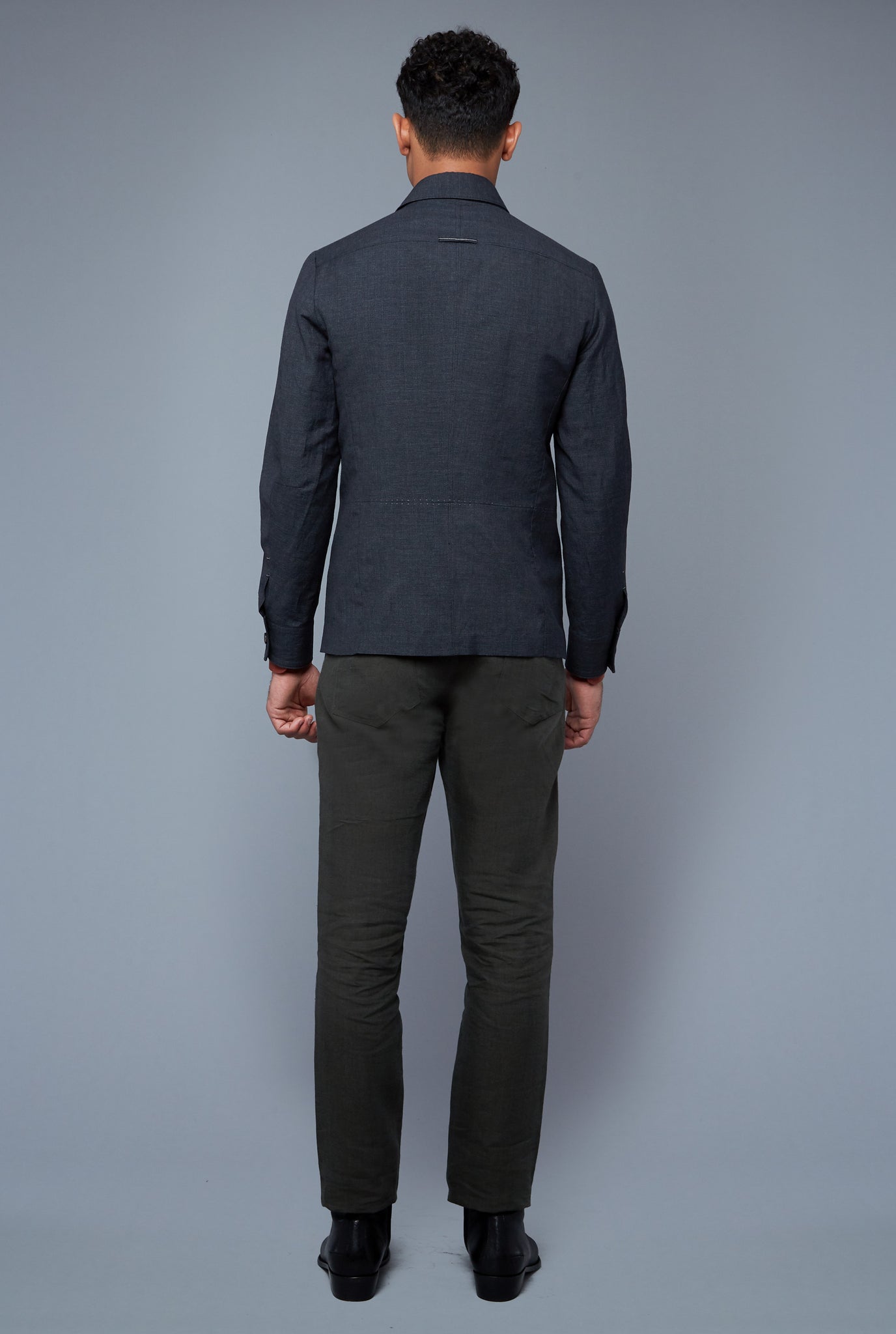 Back View: Model Tre Boutilier wearing Half Lined Téchin Jacket