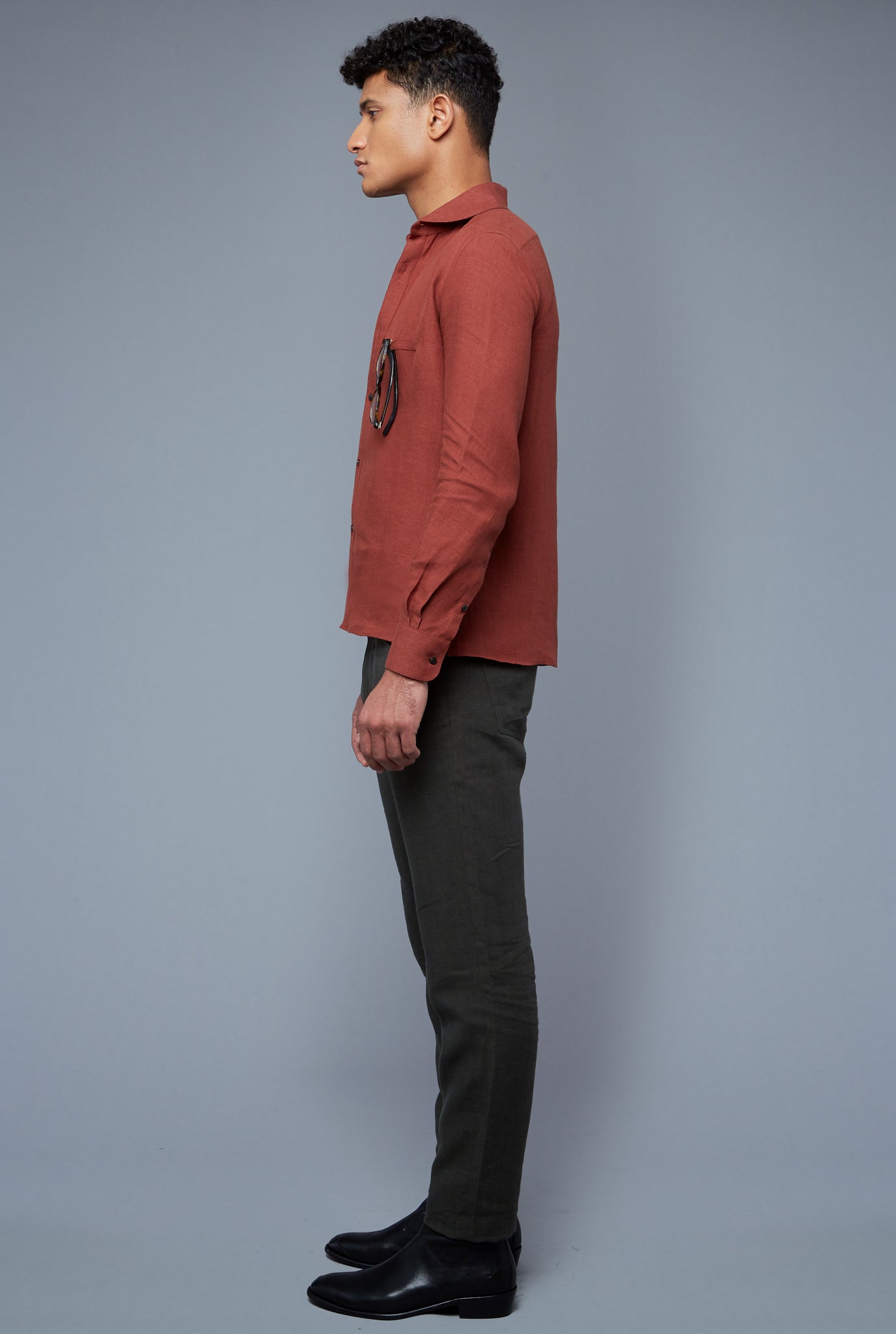 Side View: Model Tre Boutilier wearing Linen Greenwhich Shirt