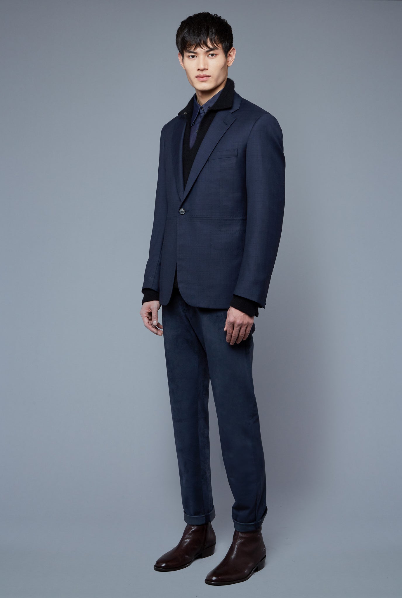 Three Quarter View: Model Qiang Li wearing Notch Lapel Jacket