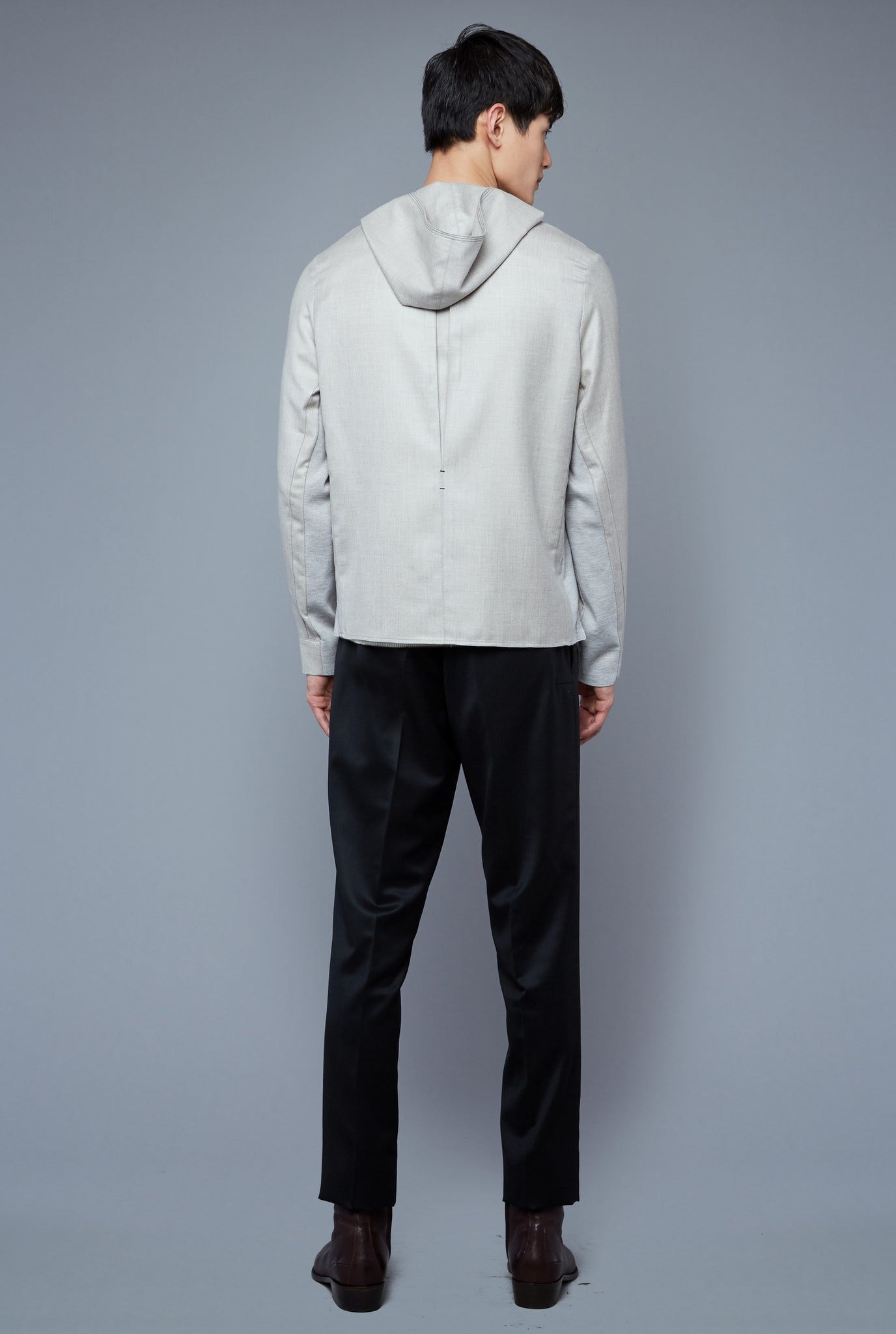 Back View: Model Qiang Li wearing Woven Hoodie