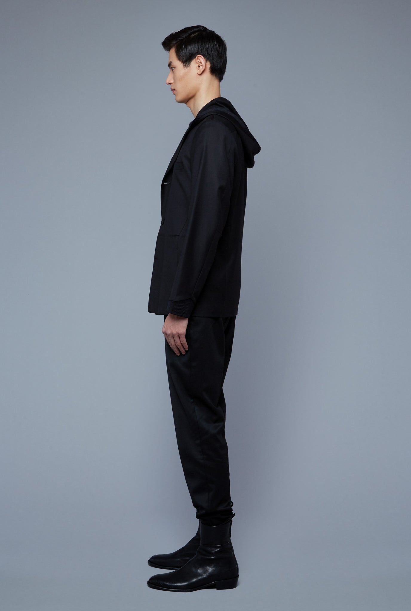 Side View: Model Qiang Li wearing Wool Hooded Jacket