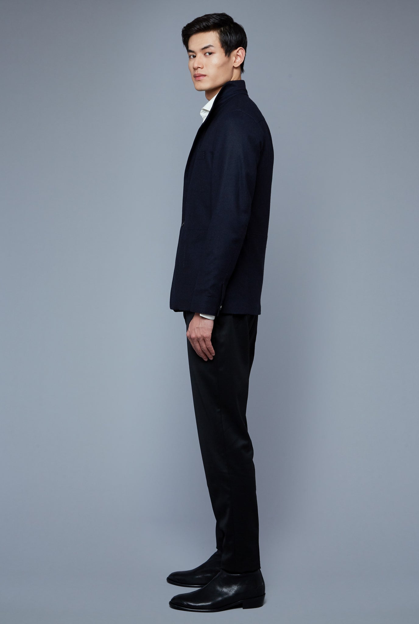 Side View: Model Qiang Li wearing Architect's Jacket