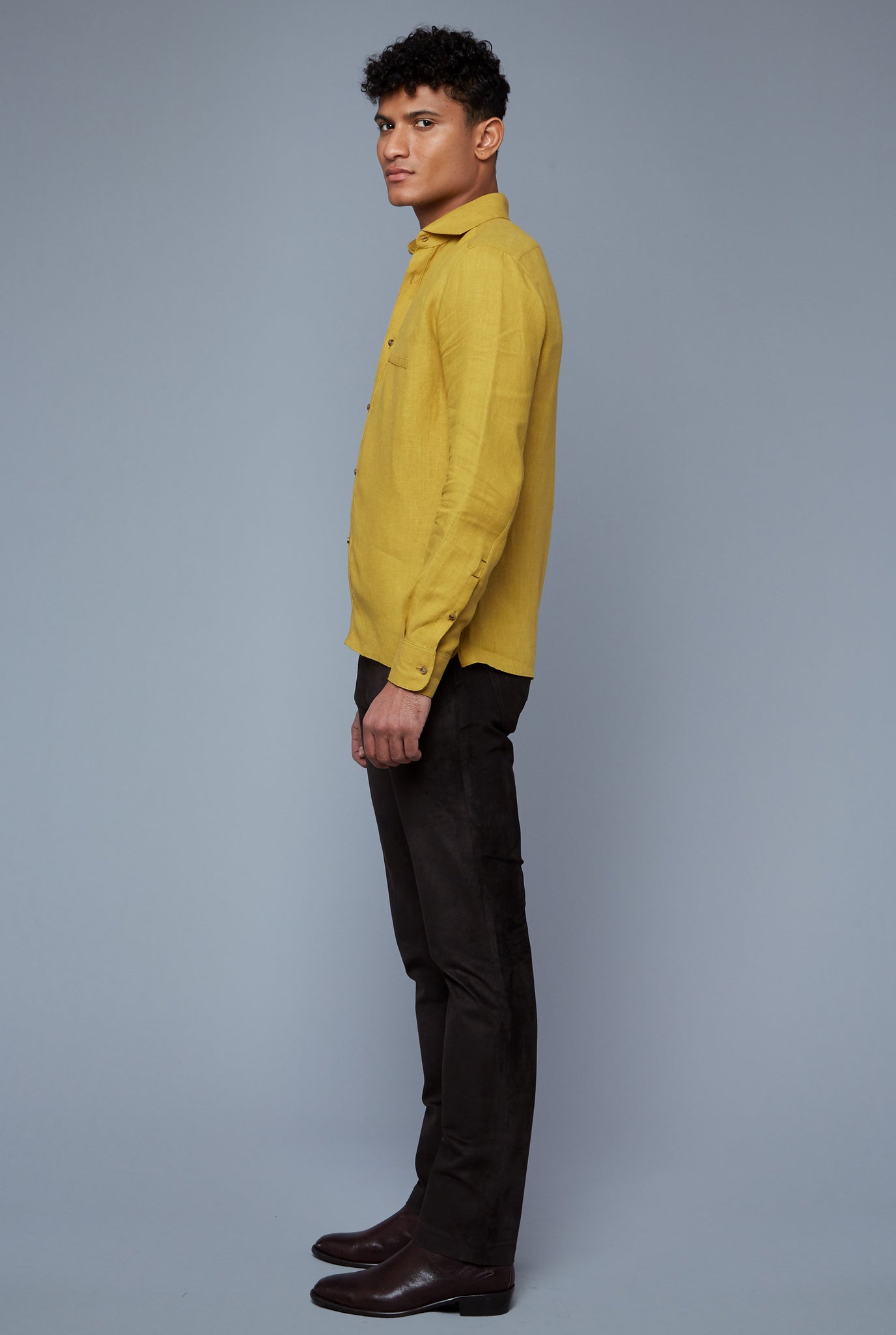 Side View: Model Tre Boutilier wearing Linen Greenwhich Shirt