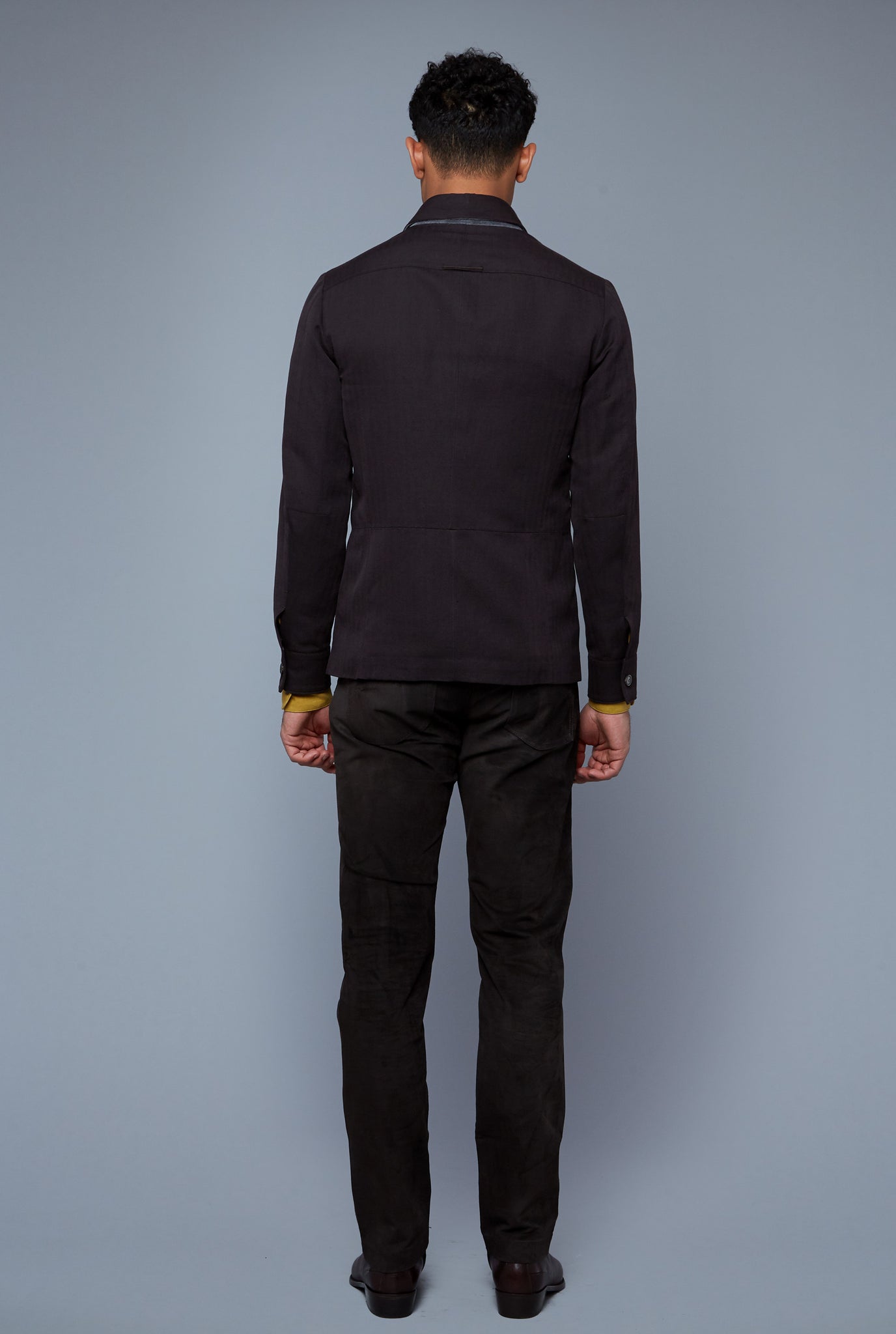 Back View: Model Tre Boutilier wearing Half Lined Téchin Jacket