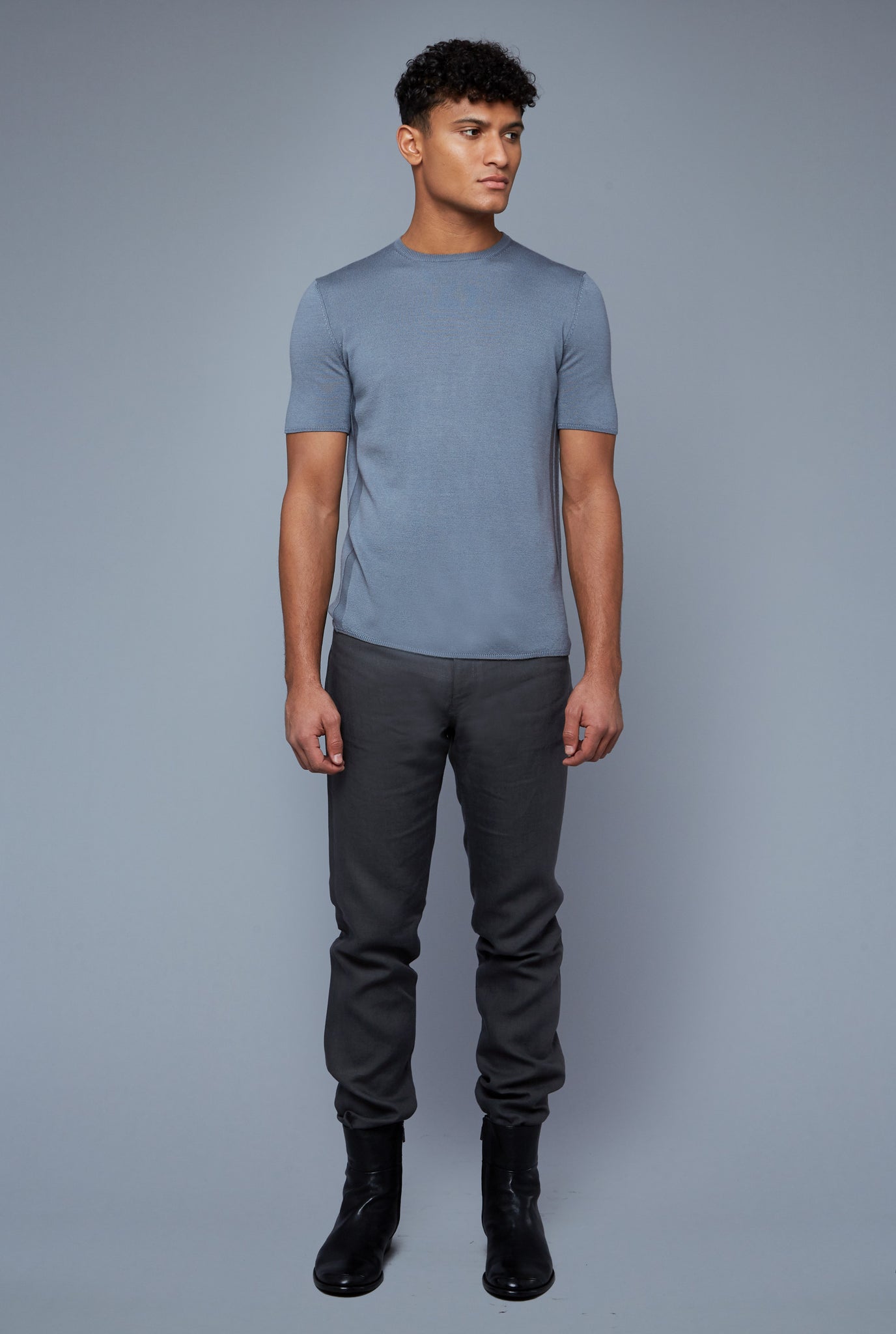 Front View: Model Tre Boutilier wearing Short Sleeve Sweater Tee