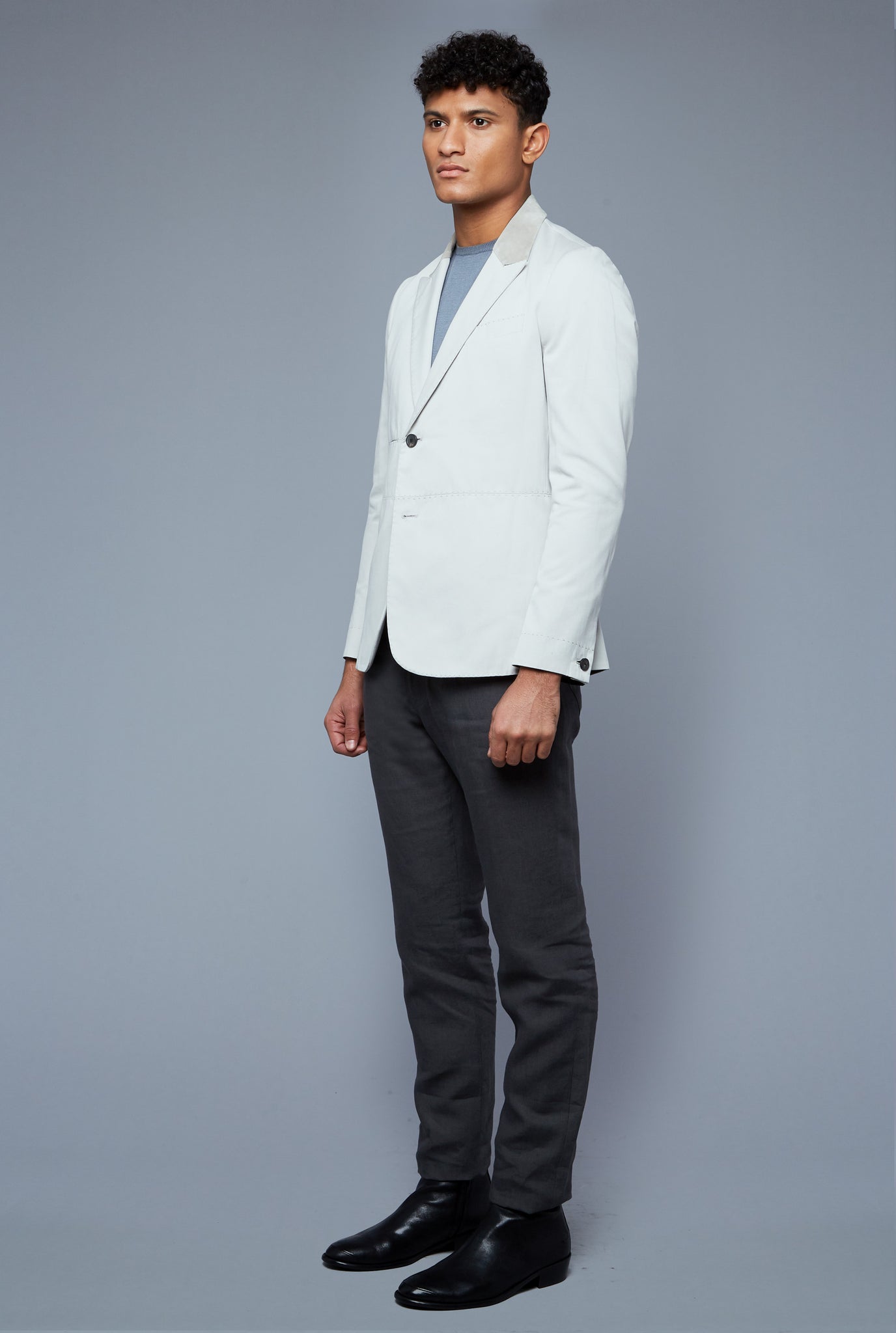 Three Quarter View: Model Tre Boutilier wearing Peak Summer Jacket