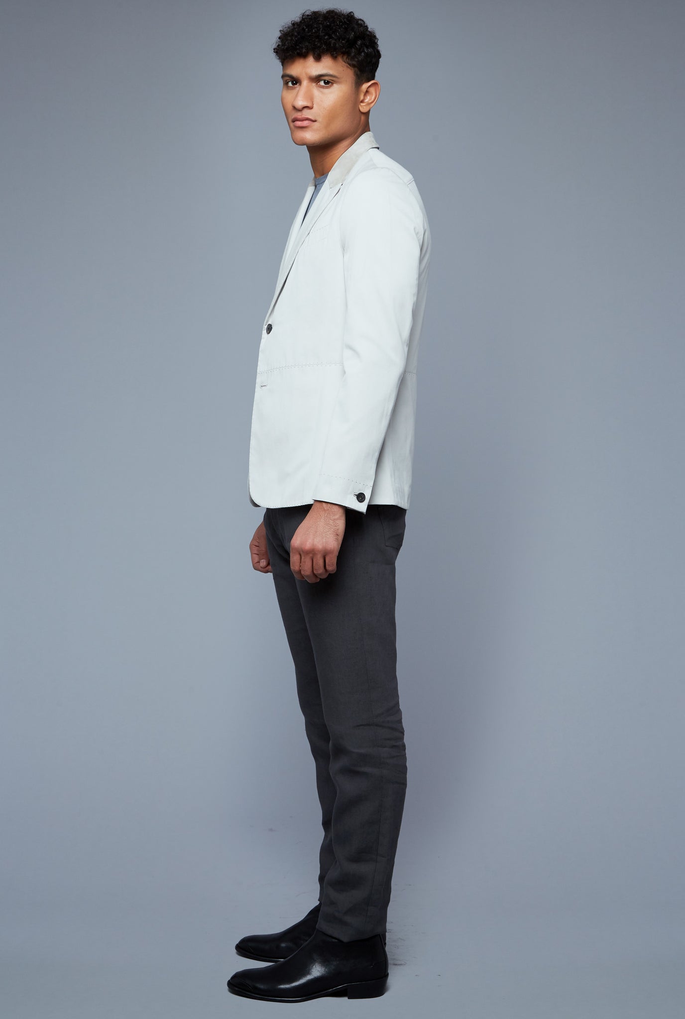 Side View: Model Tre Boutilier wearing Peak Summer Jacket