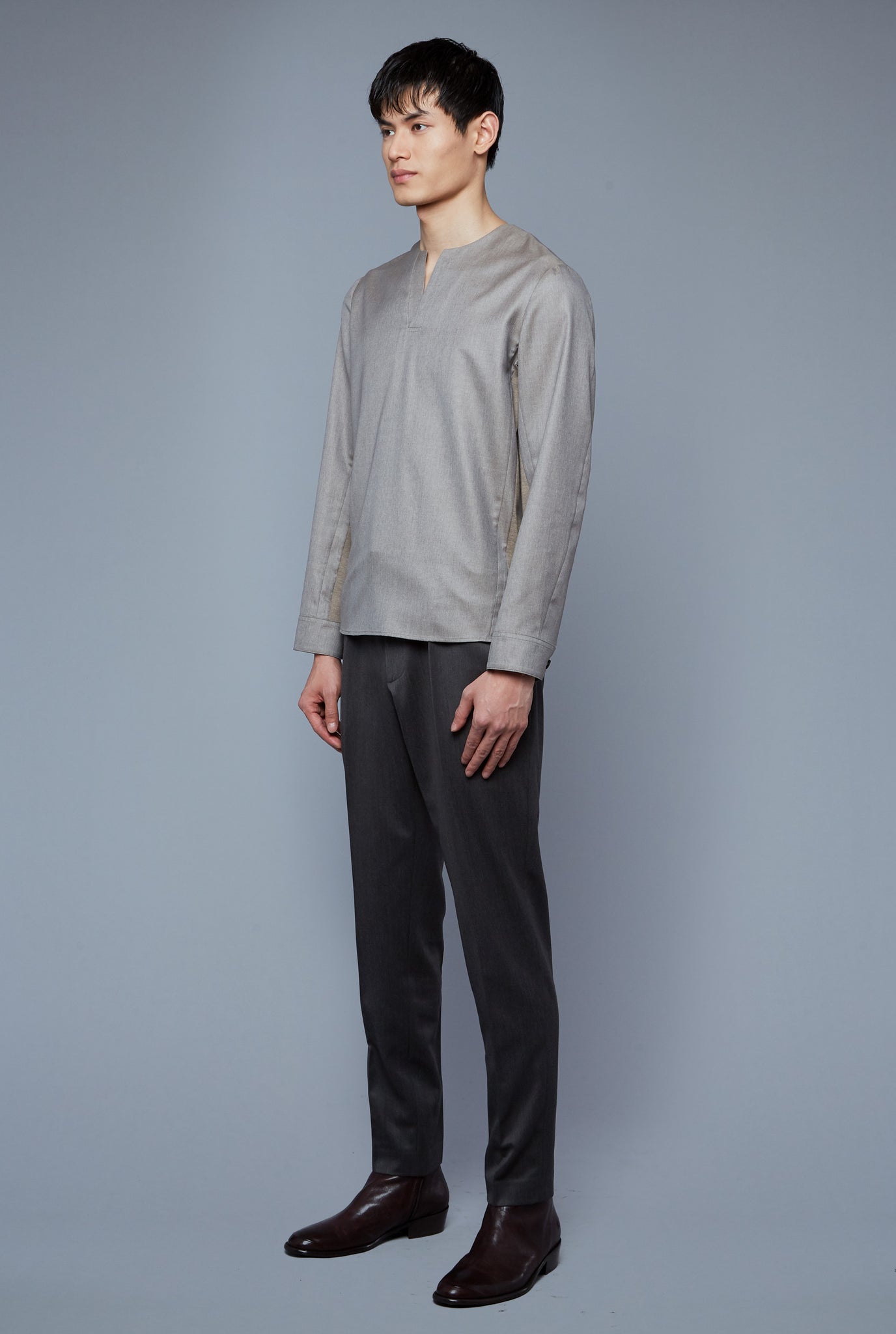 Three Quarter View: Model Qiang Li wearing Woven Henley