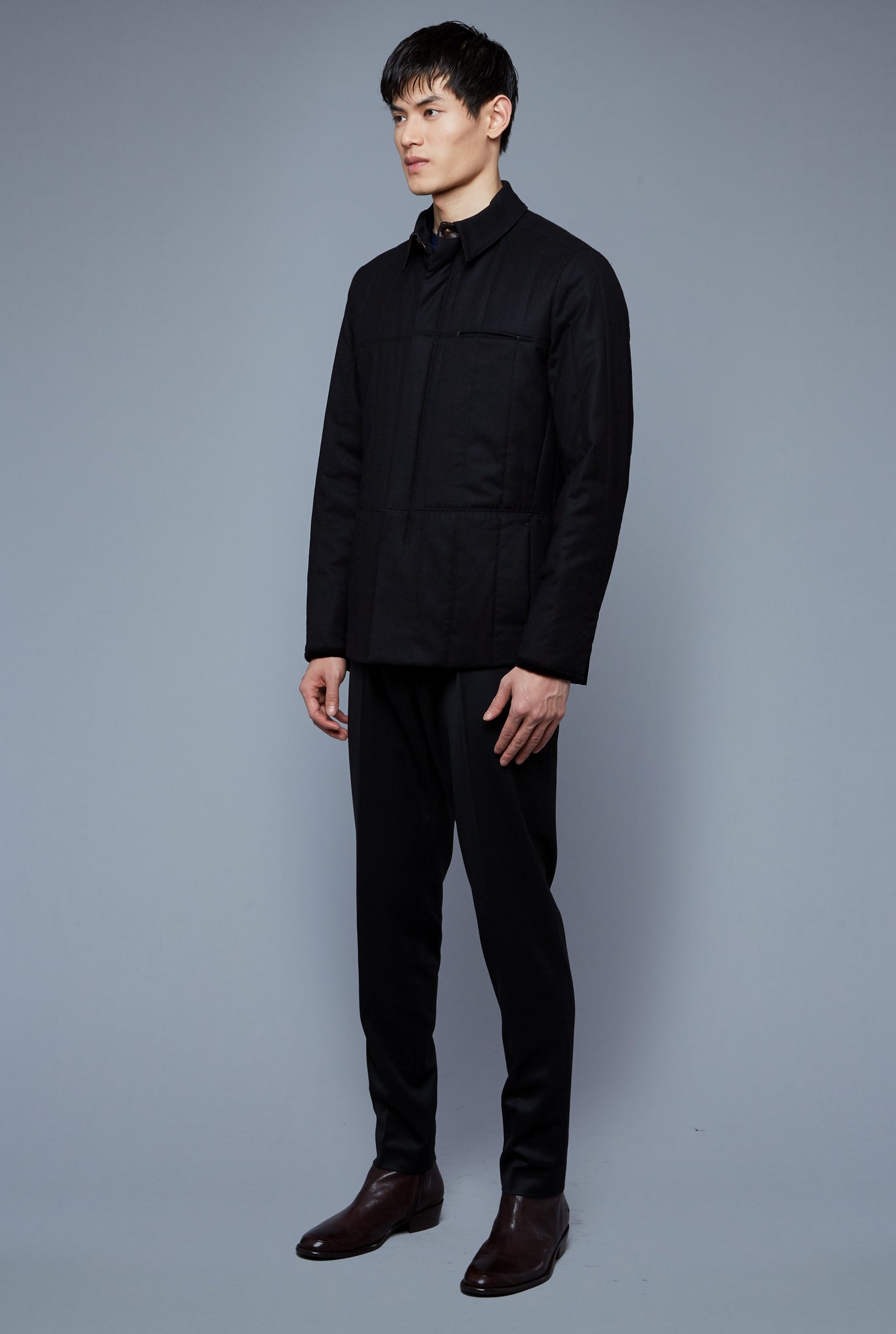 Three Quarter View: Model Qiang Li wearing Down Téchin Jacket