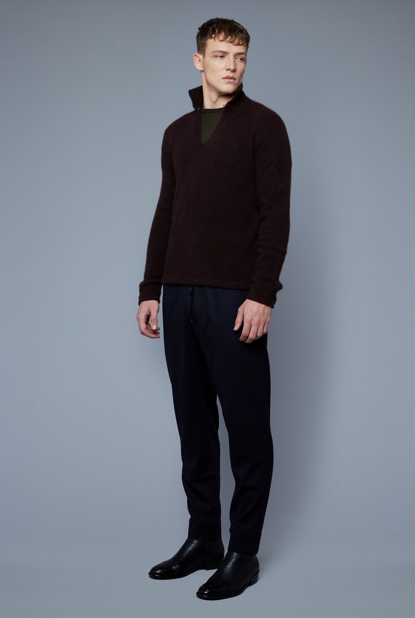 Three Quarter View: Model Milos Drago wearing Cashmere Boucle Sweater