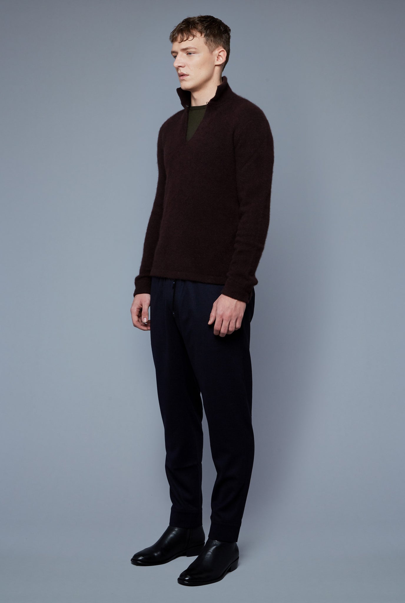 Three Quarter View: Model Milos Drago wearing Cashmere Boucle Sweater