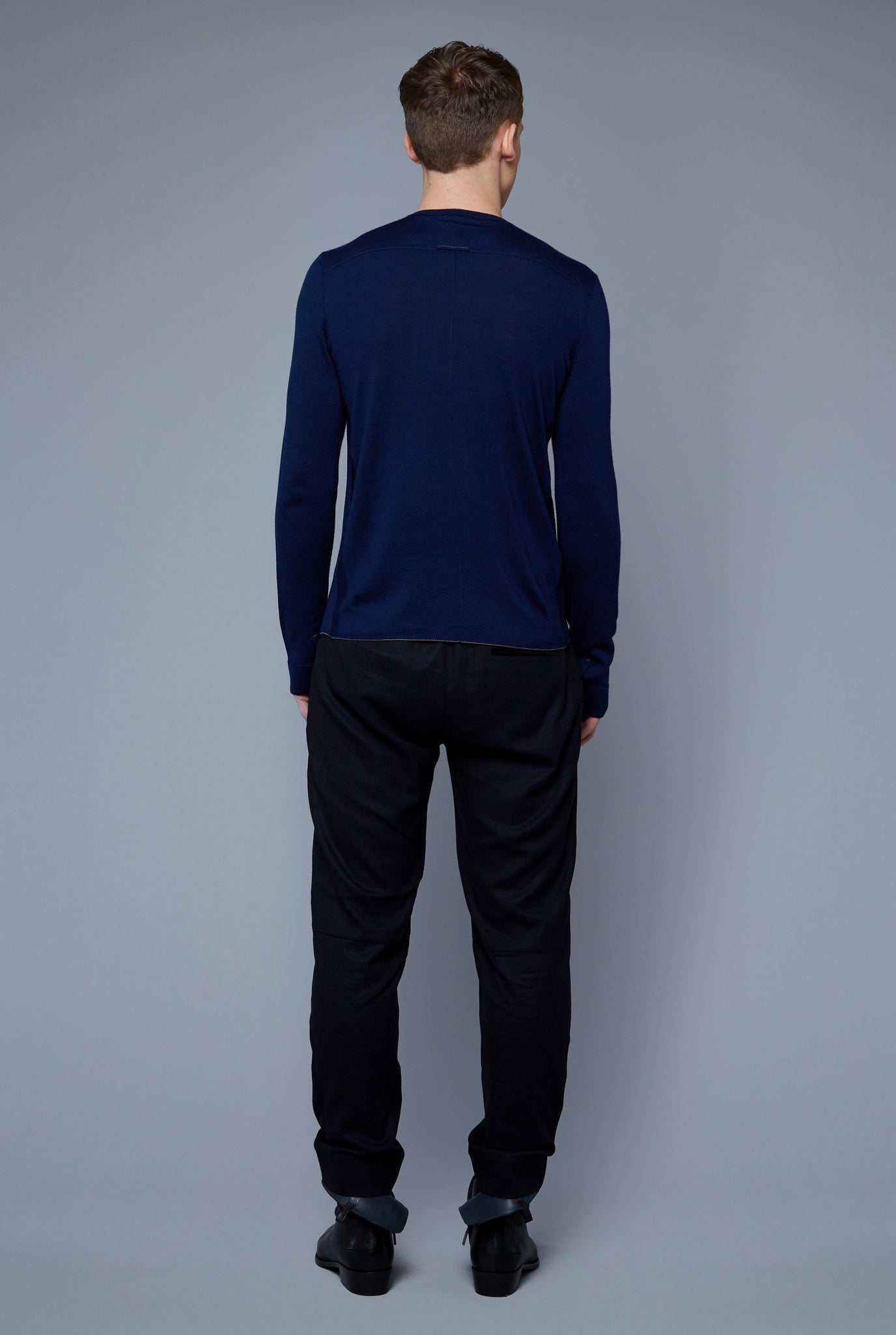 Back View: Model Milos Drago wearing Long Sleeve Sweater Tee