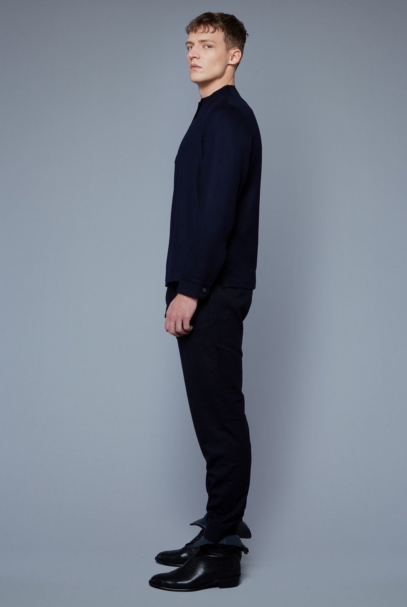 Side View: Model Milos Drago wearing Royal Shirt