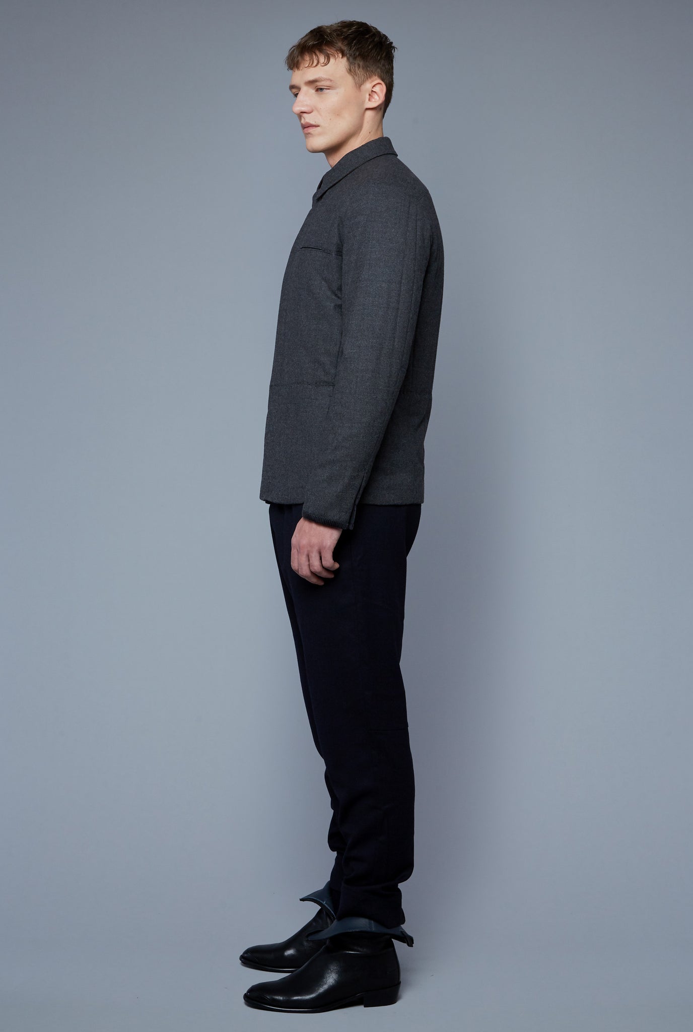 Side View: Model Milos Drago Wearing Down Téchin Jacket