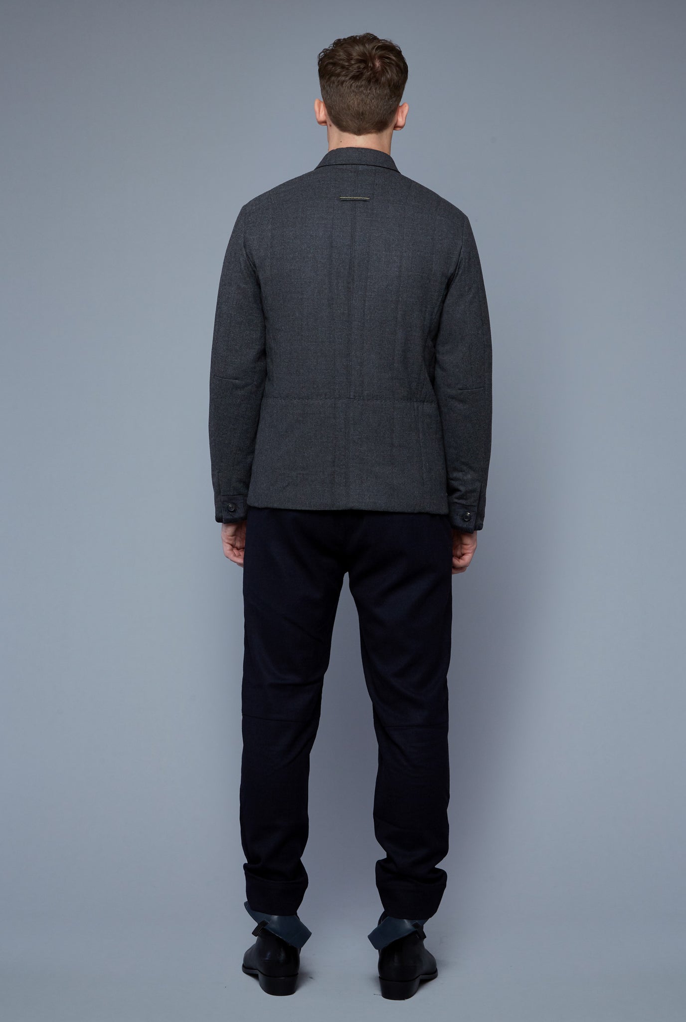 Back View: Model Milos Drago Wearing Down Téchin Jacket