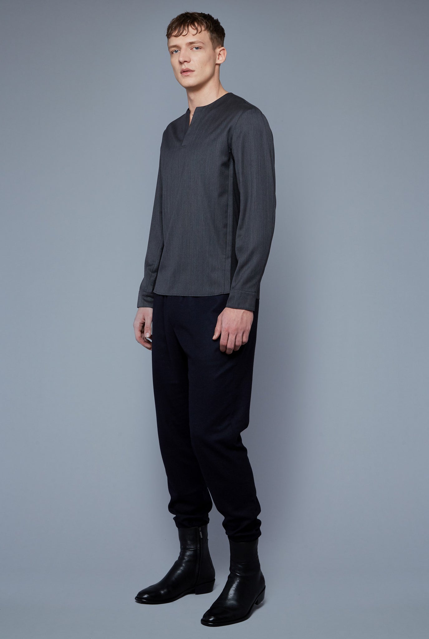 Three Quarter View: Model Milos Drago wearing Woven Henley