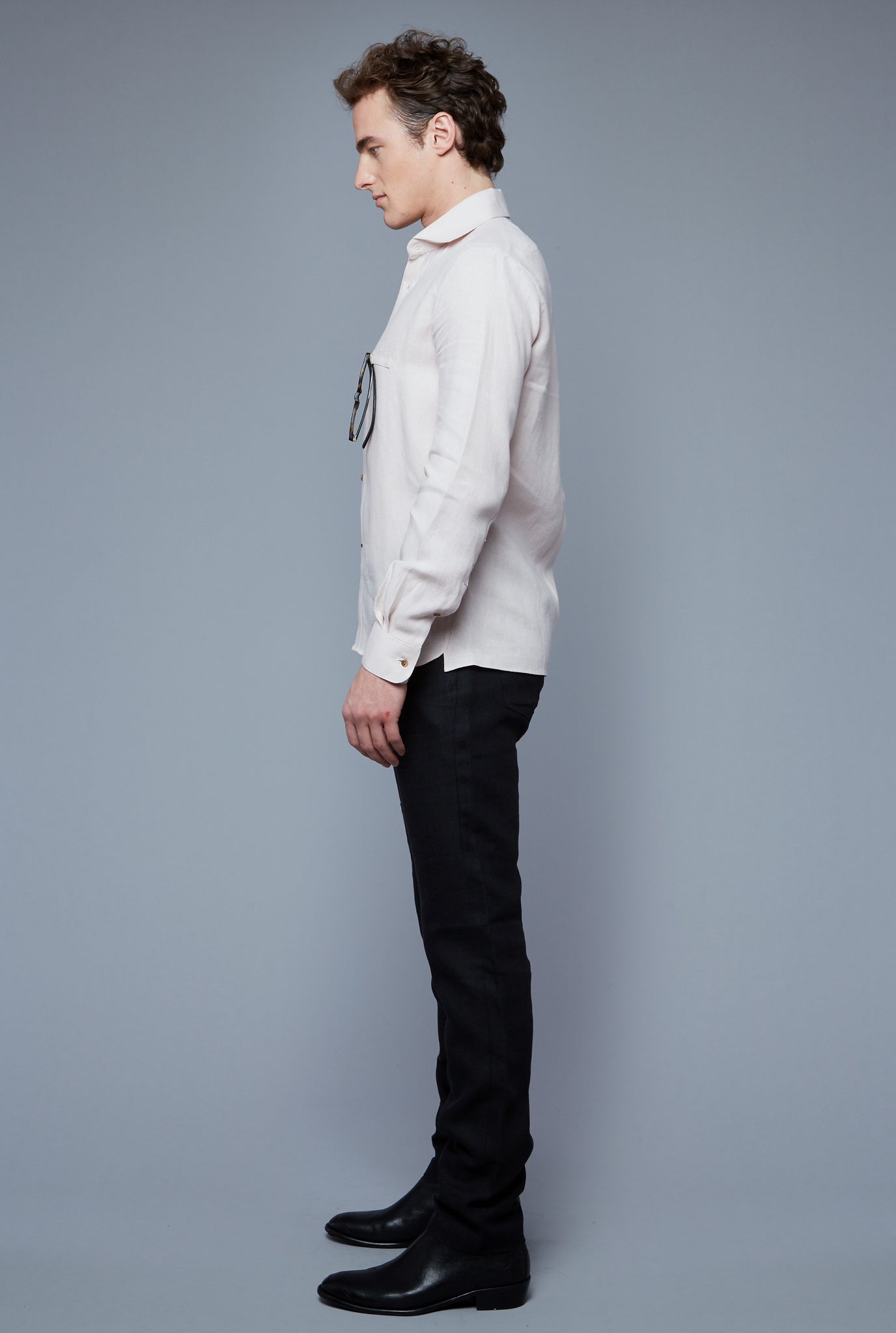 Side View: Model Hans Weiner wearing Linen Greenwhich Shirt