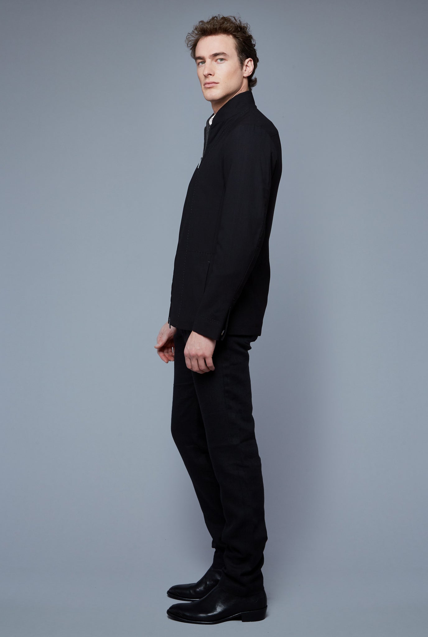 Side View: Model Hans Weiner wearing Seasonless Bomber