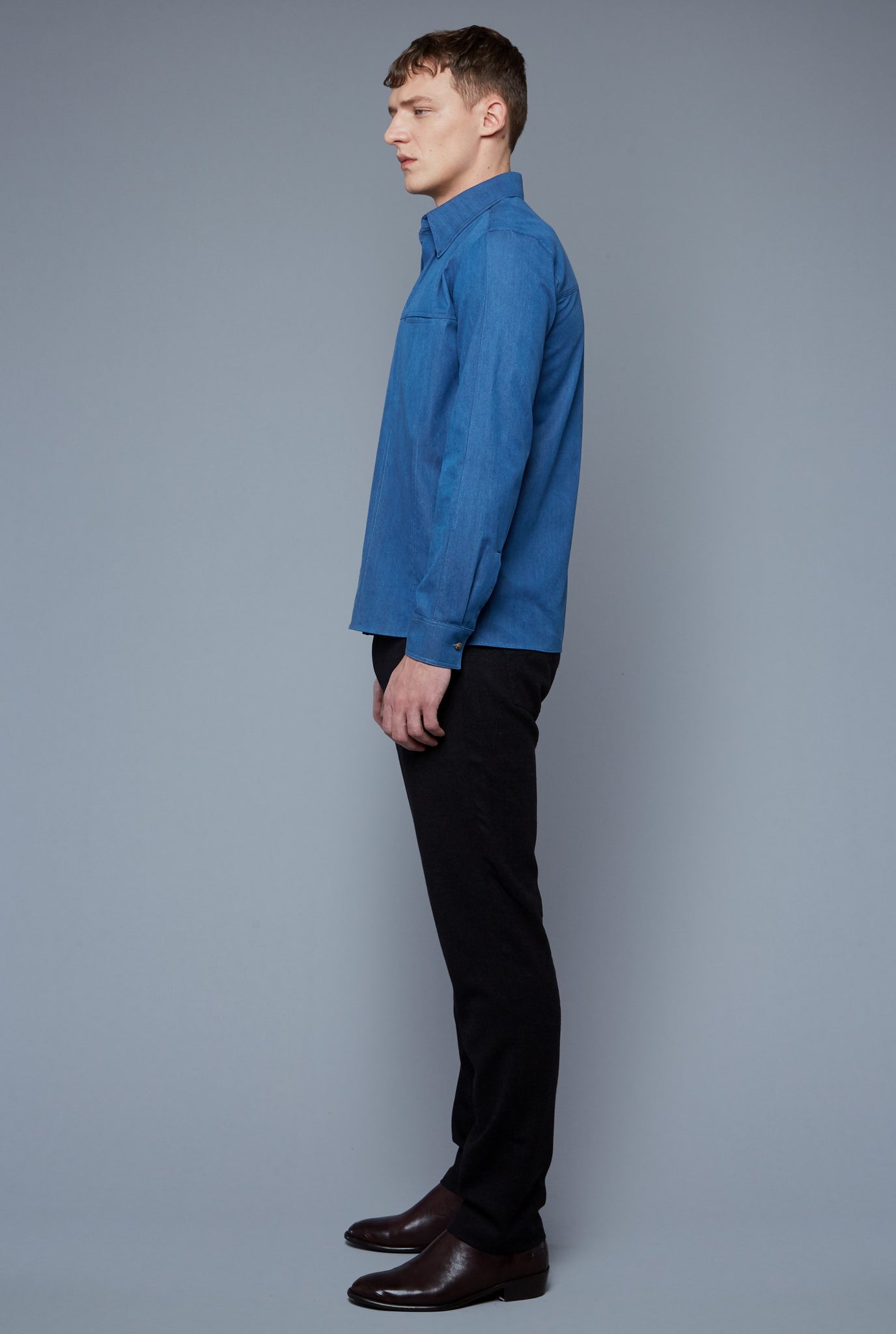 Side View: Model Milos Drago wearing Kojima Denim Shirt