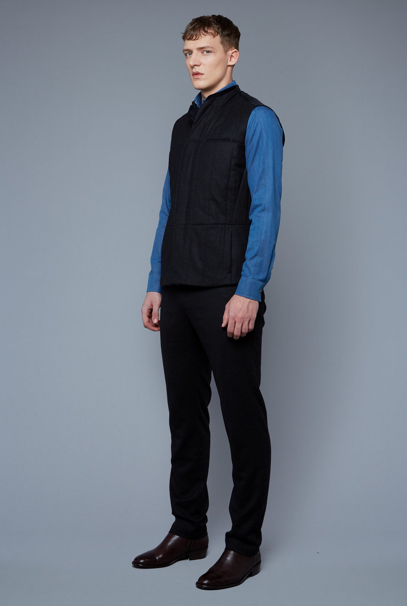 Three Quarter View: Model Milos Drago wearing Down Vest