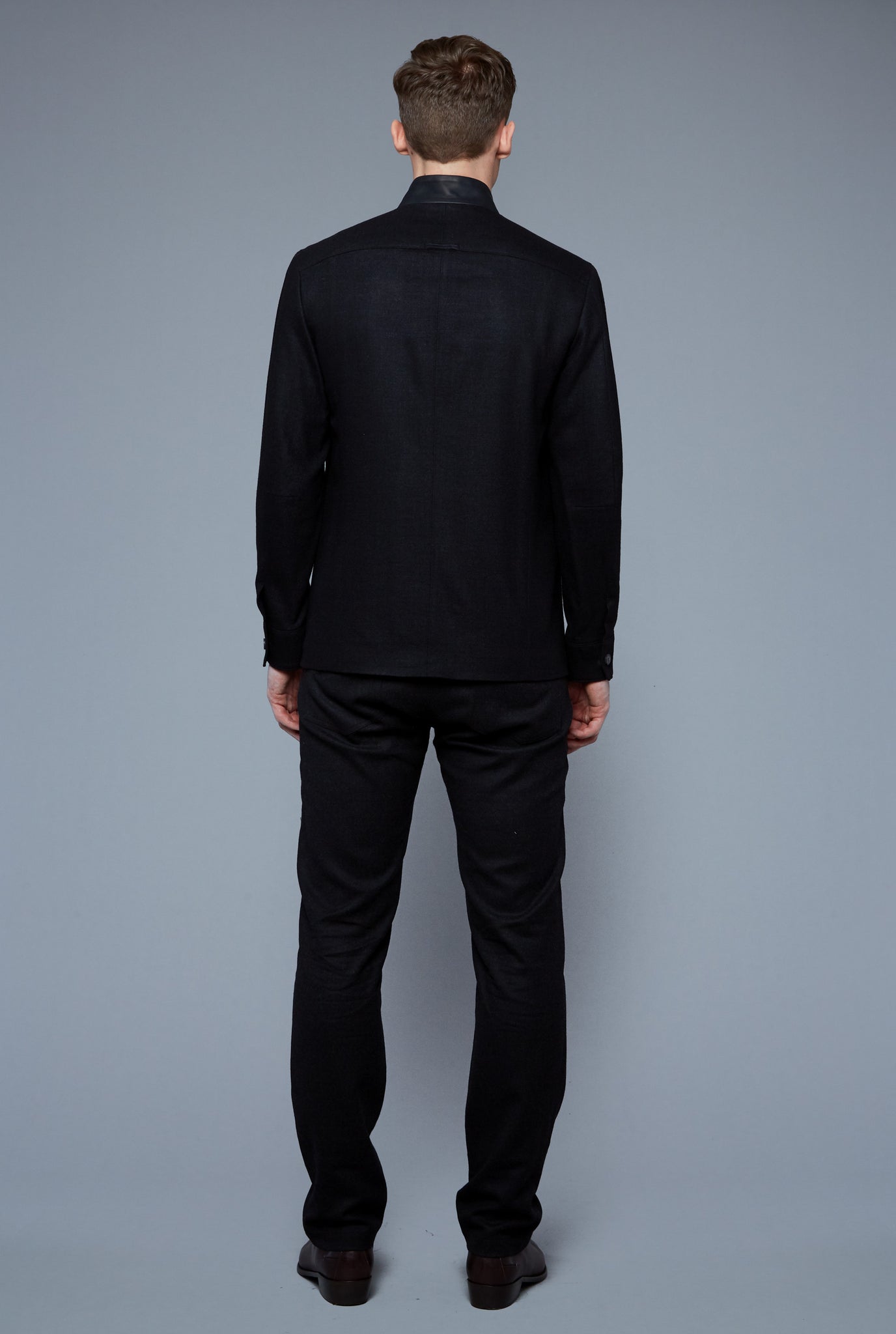 Back View: Model Milos Drago wearing Compass Jacket