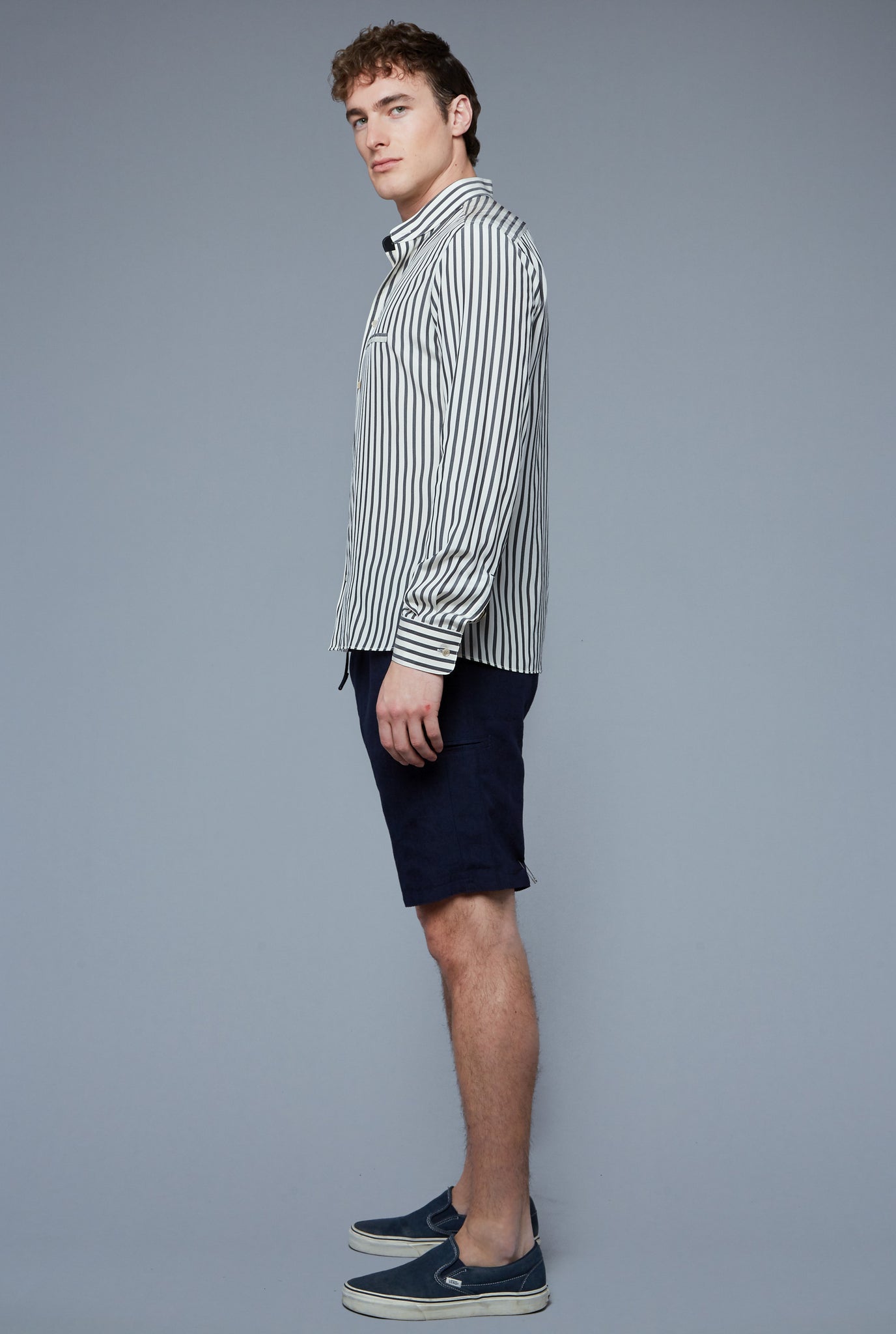 Side View: Model Hans Weiner wearing Silk Mercer Shirt