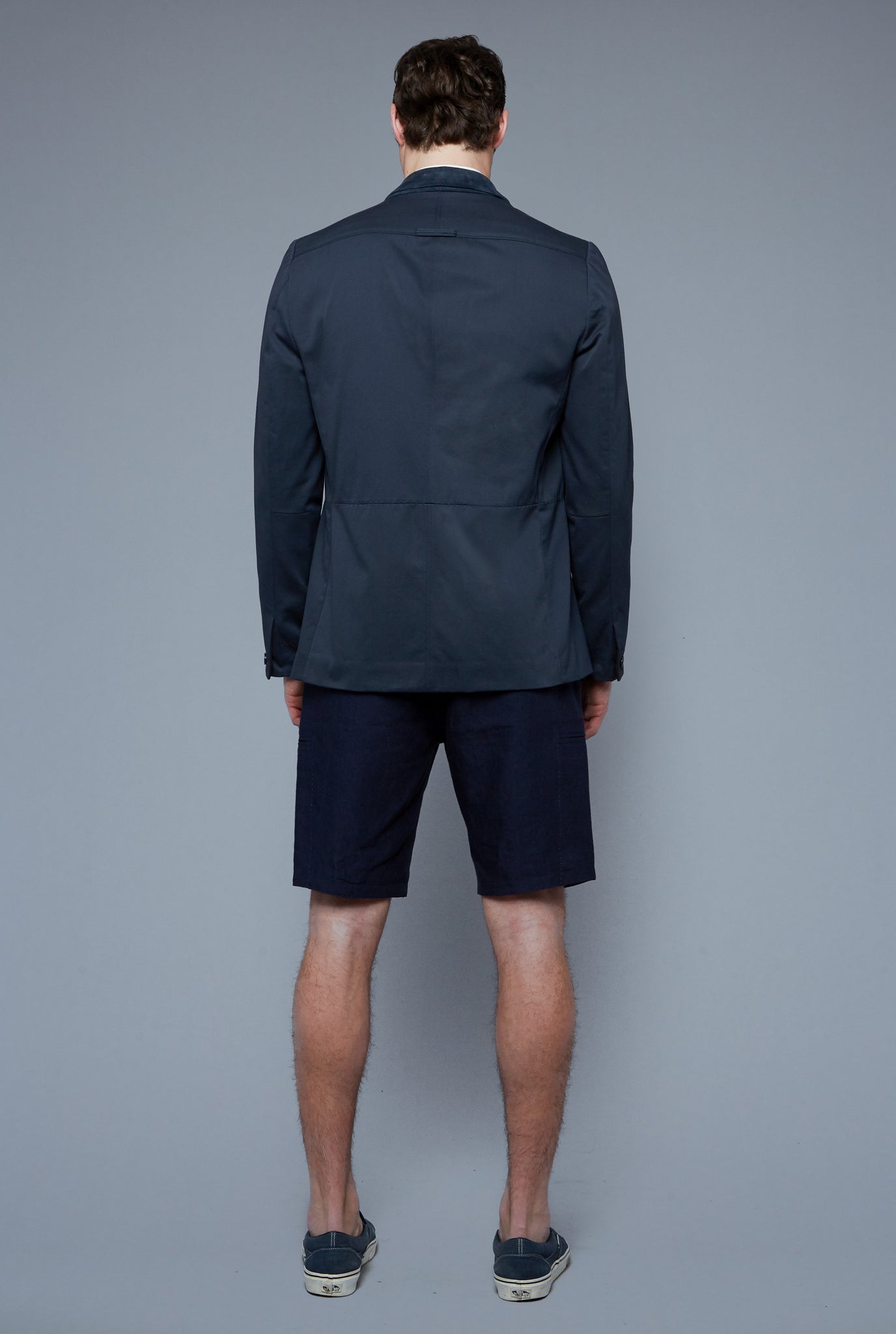 Back View: Model Hans Weiner wearing Peak Summer Jacket