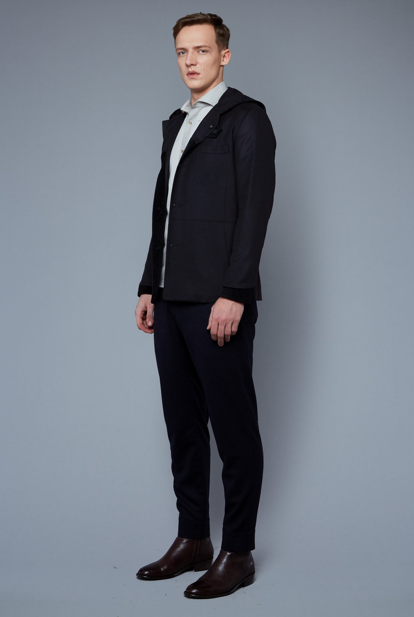 Three Quarter View: Model Milos Drago wearing Cashmere Hoodied Jacket