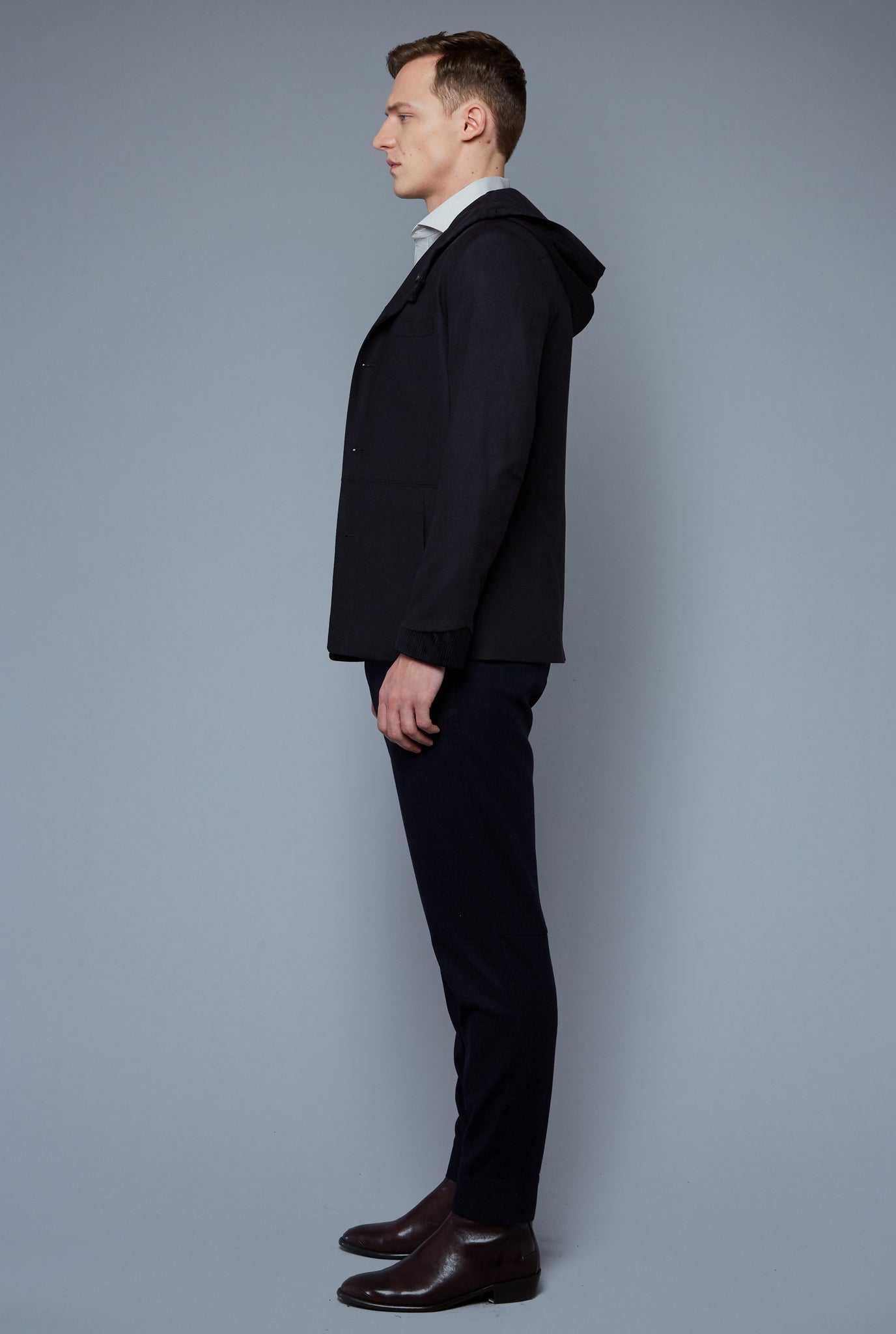 Side View: Model Milos Drago wearing Cashmere Hoodied Jacket