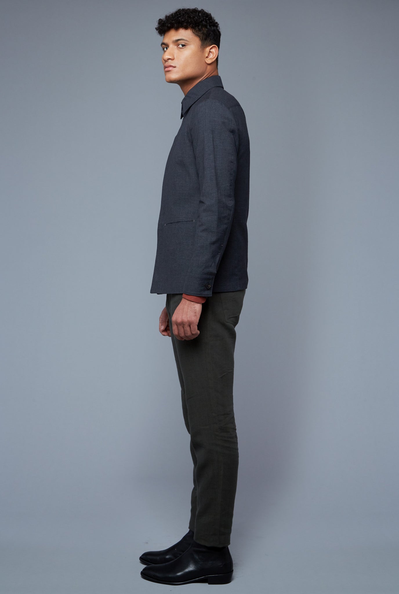 Side View: Model Tre Boutilier wearing Half Lined Téchin Jacket