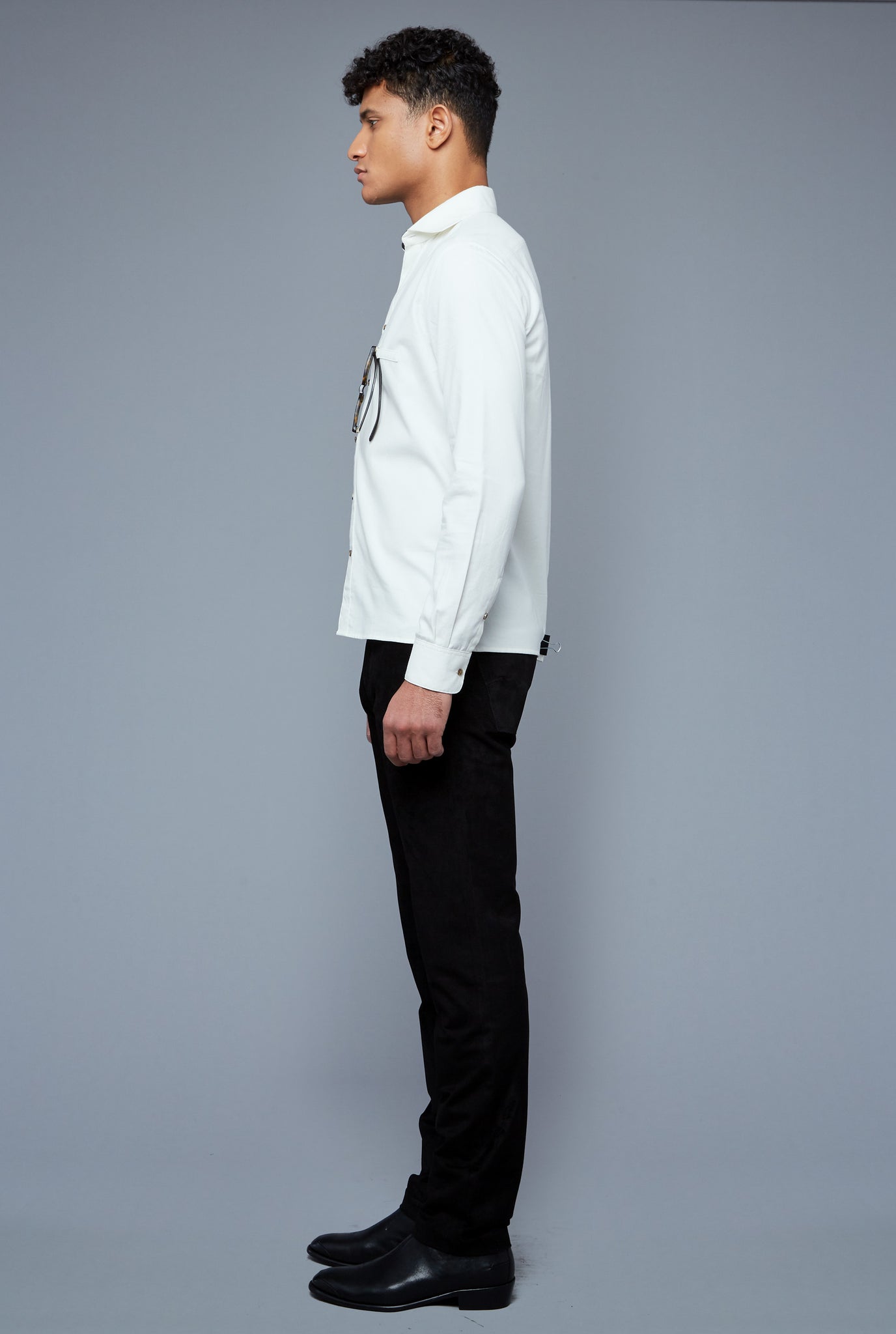 Side View: Model Tre Boutilier wearing Flannel Greenwich Shirt