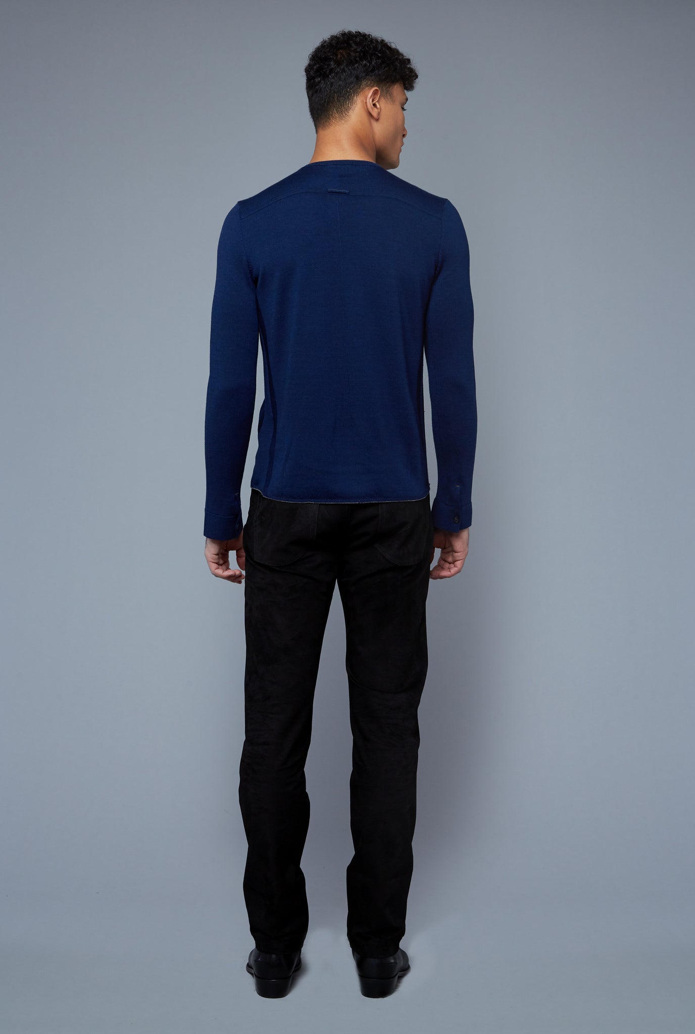 Back View: Model Tre Boutilier wearing Long Sleeve Sweater Tee