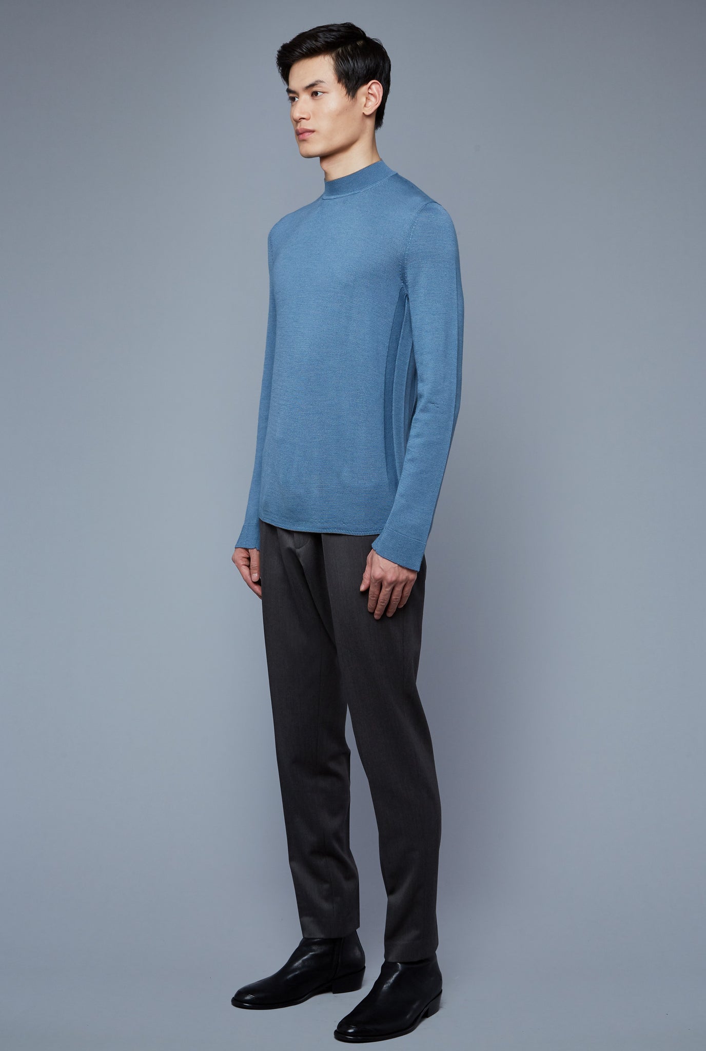 Three Quarter View: Model Qiang Li wearing Royal Neck Sweater Tee
