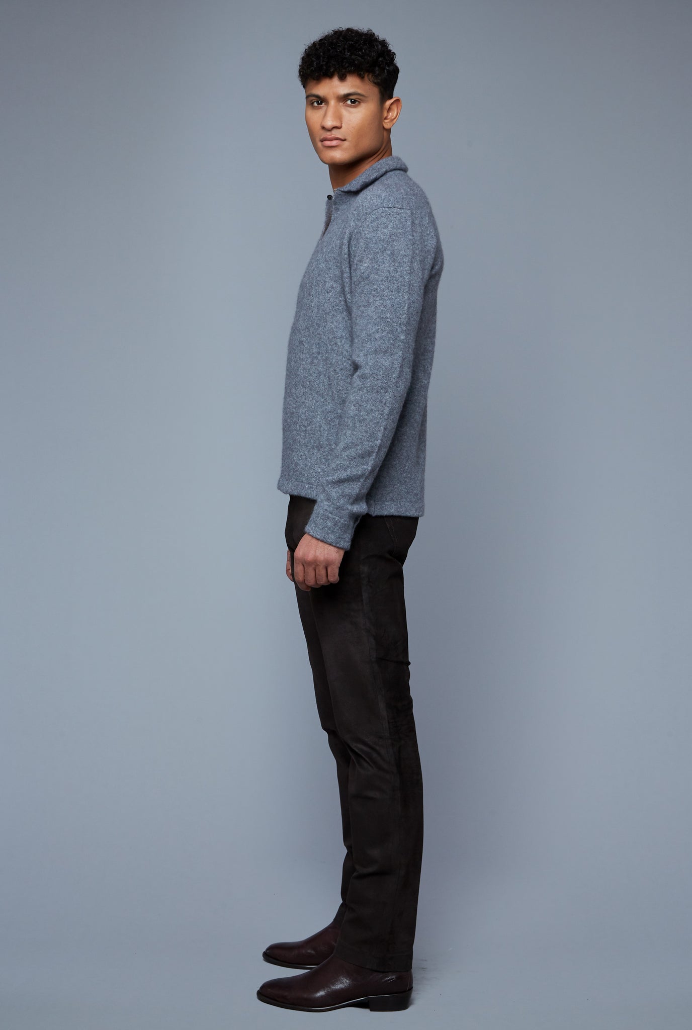 Side View: Model Tre Boutilier wearing Cashmere Boucle Sweater
