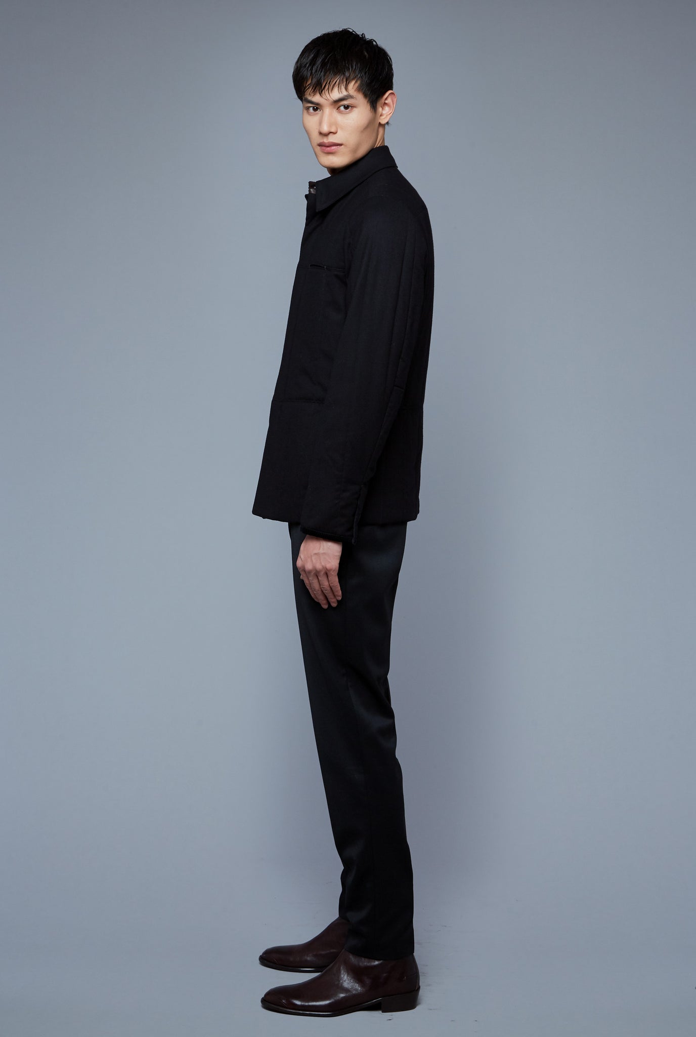 Side View: Model Qiang Li wearing Down Téchin Jacket