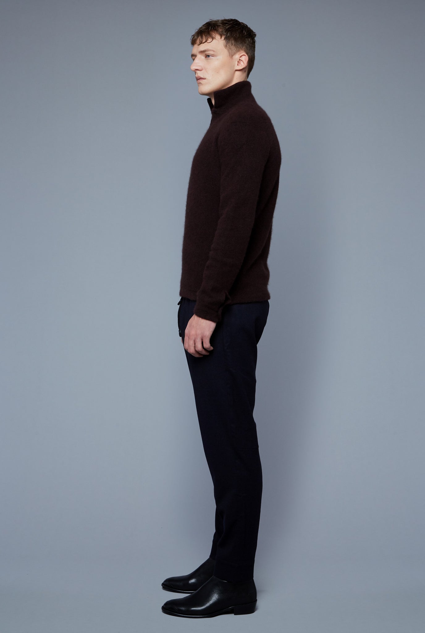 Side View: Model Milos Drago wearing Cashmere Boucle Sweater