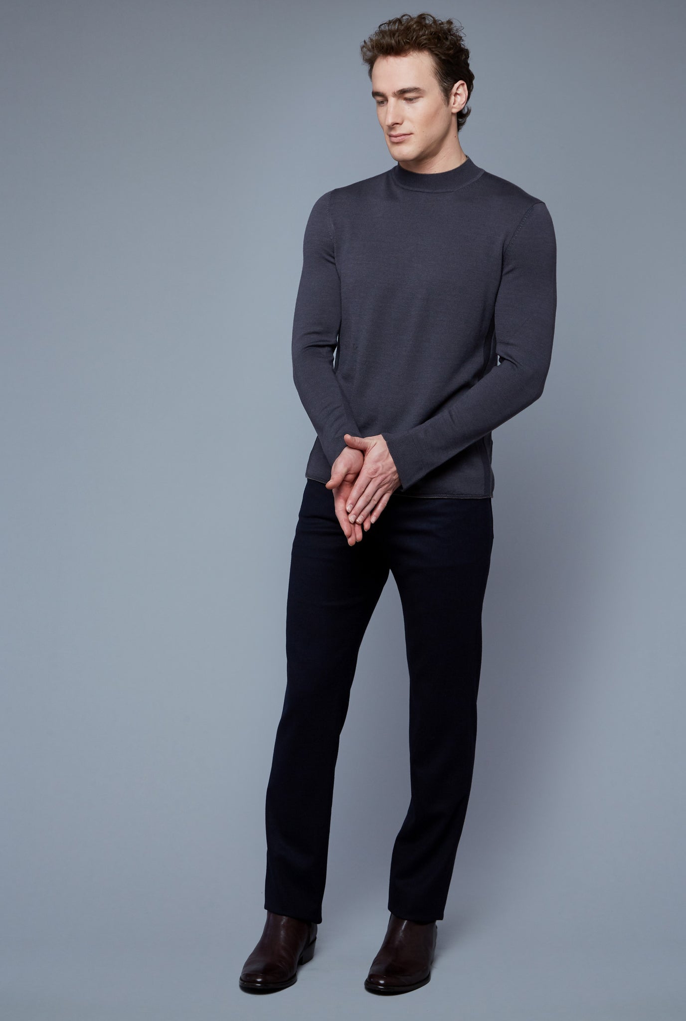 Three Quarter View: Model Hans Weiner wearing Royal Neck Sweater Tee