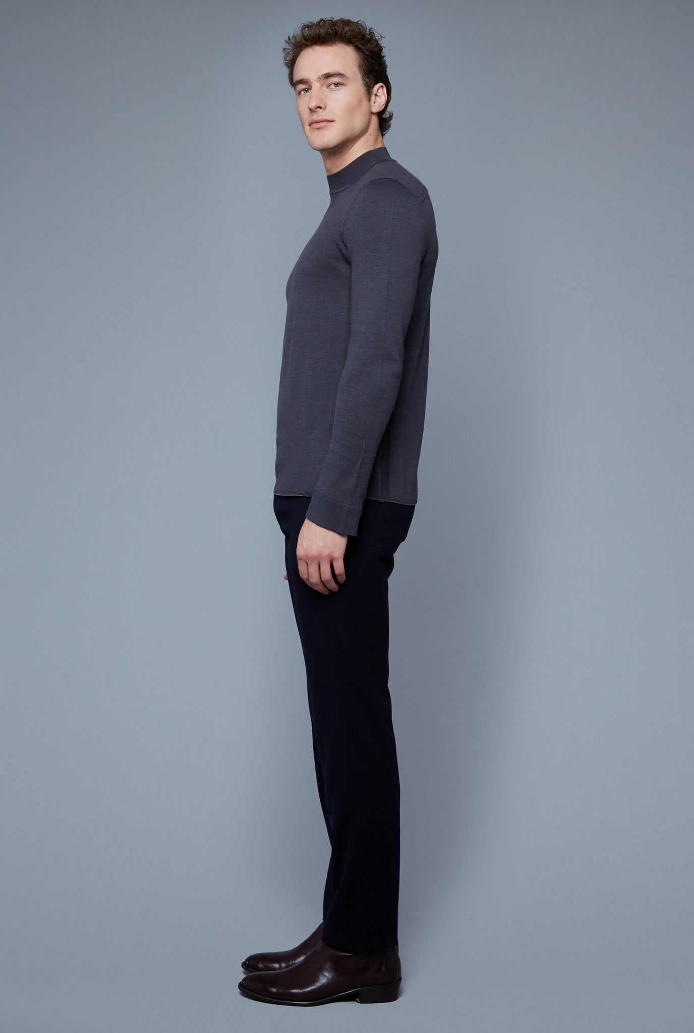 Side View: Model Hans Weiner wearing Royal Neck Sweater Tee