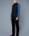 Three Quarter View: Model Milos Drago wearing Down Vest