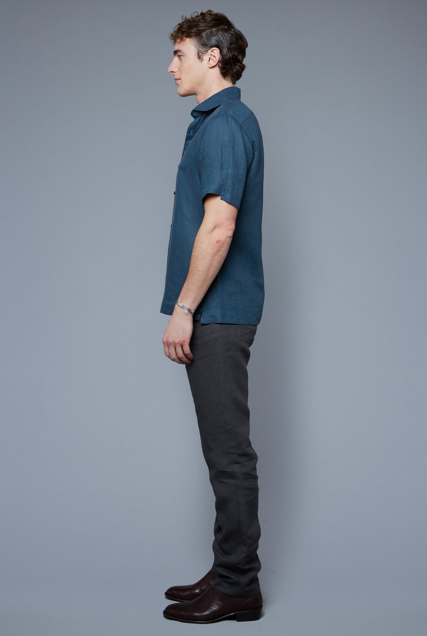 Side View: Model Hans Weiner wearing Aloe Linen Shirt