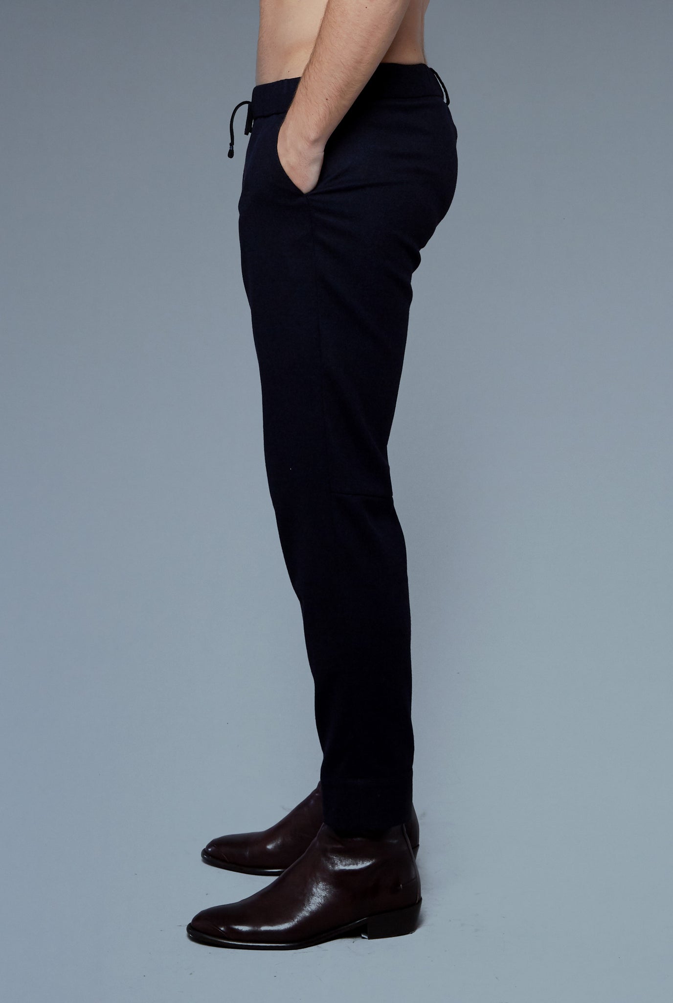 Side View: Model Milos Drago wearing Sweatpants
